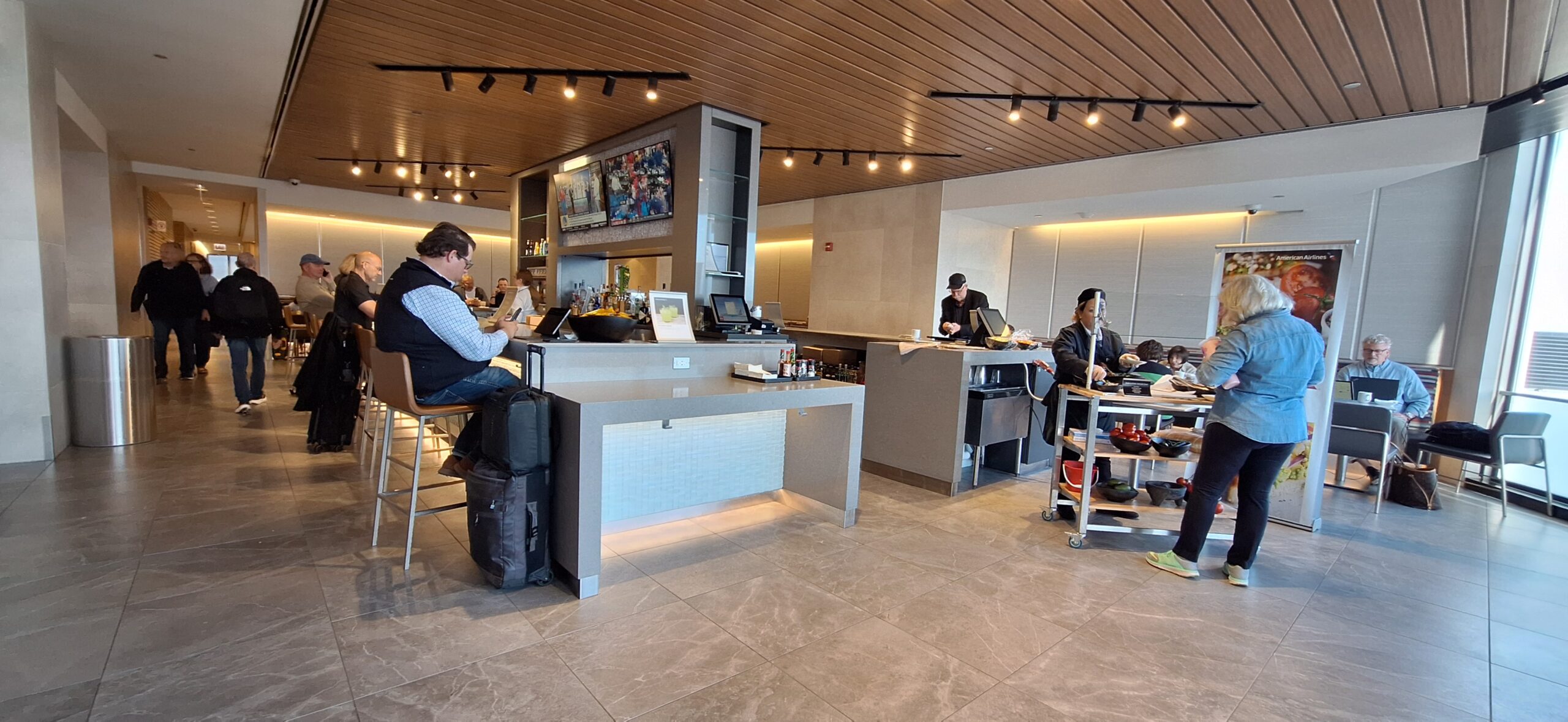 people sitting at a counter in a restaurant