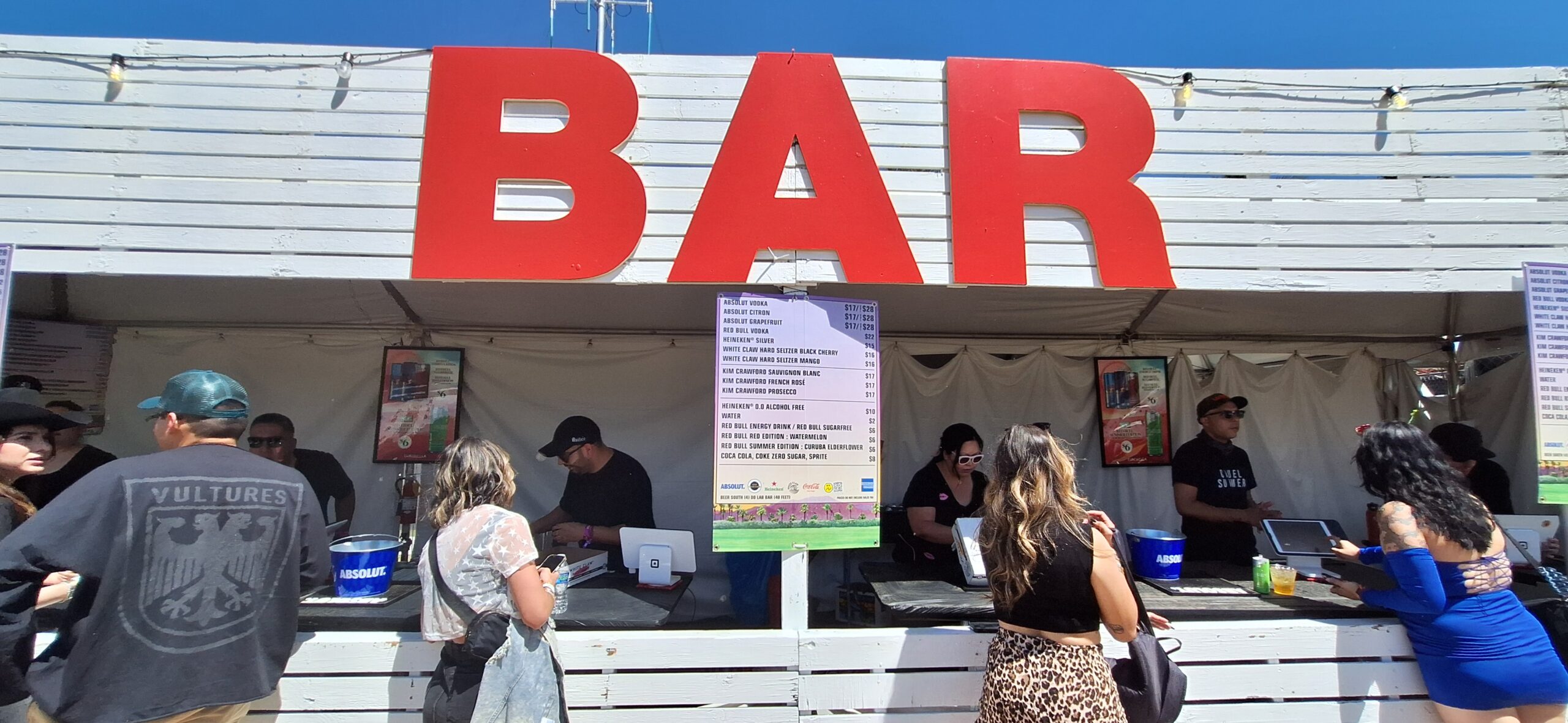 people standing in front of a bar