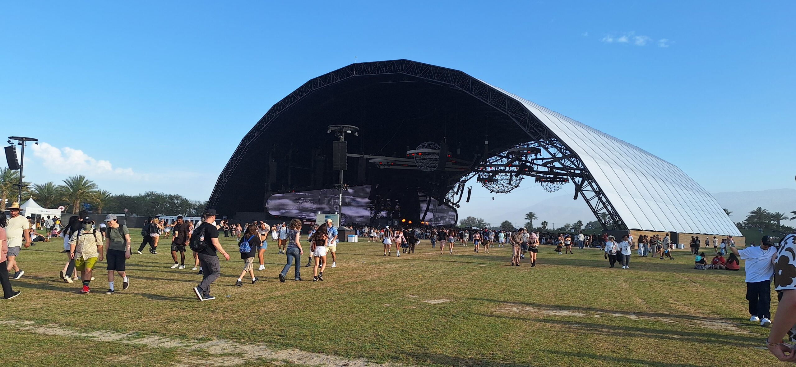 a group of people walking around a stage