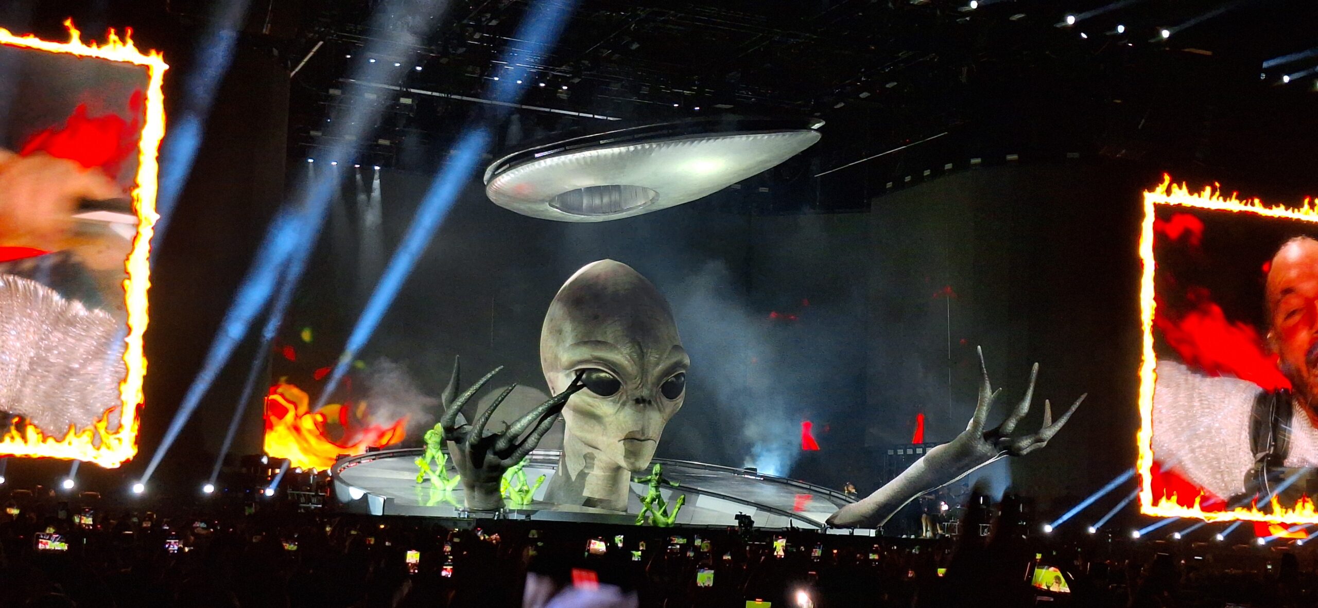 a large alien on a stage