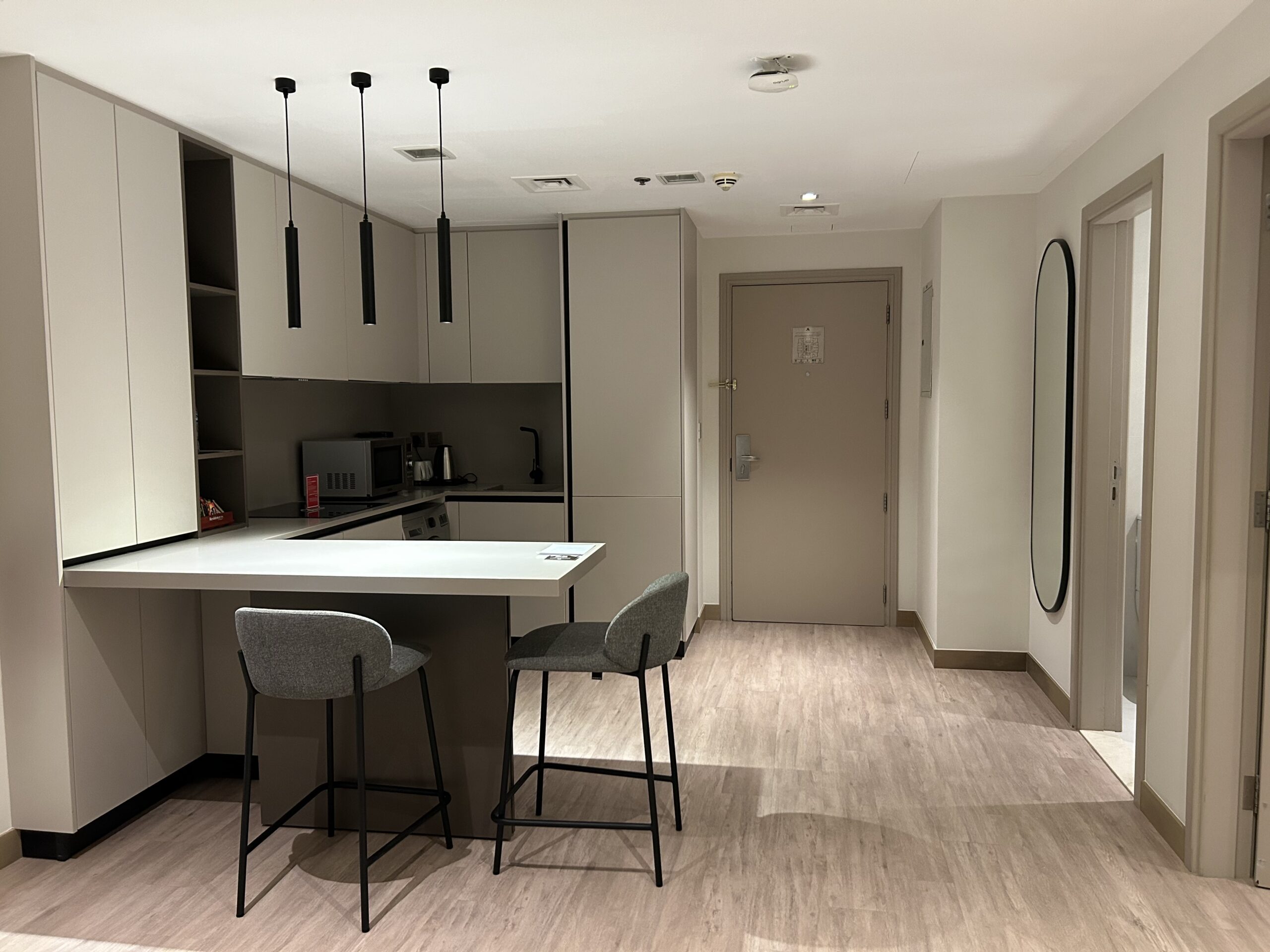 a kitchen with a bar and stools