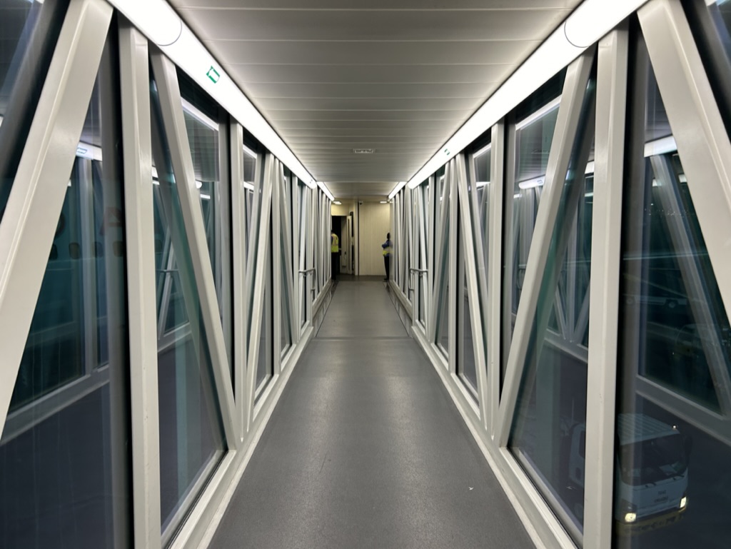 a long hallway with glass windows