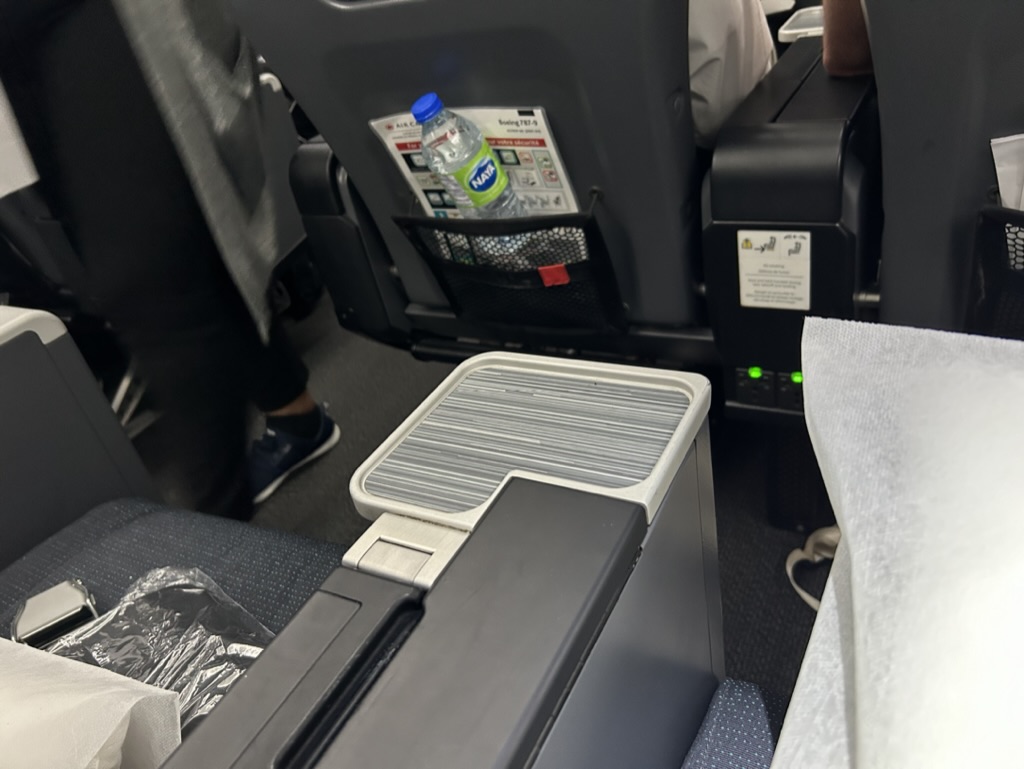 a seat with a drink bottle in the back