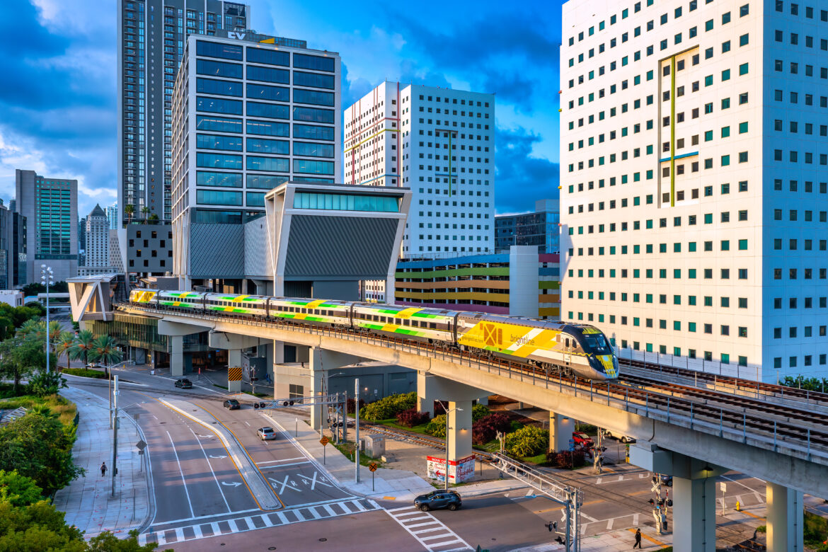 a train on a track in a city