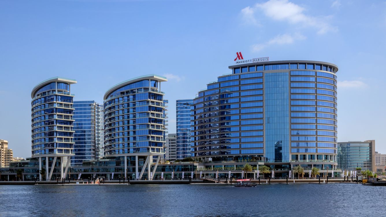 a group of buildings next to a body of water