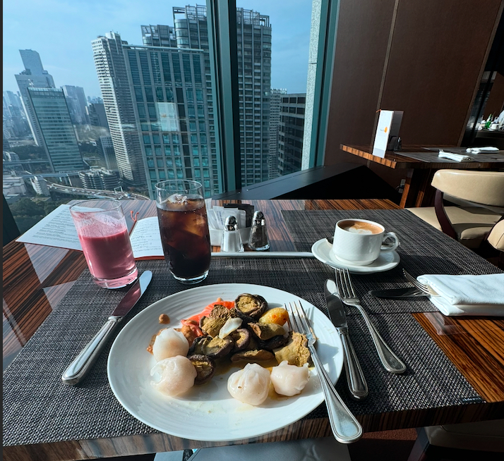 a plate of food and drinks on a table