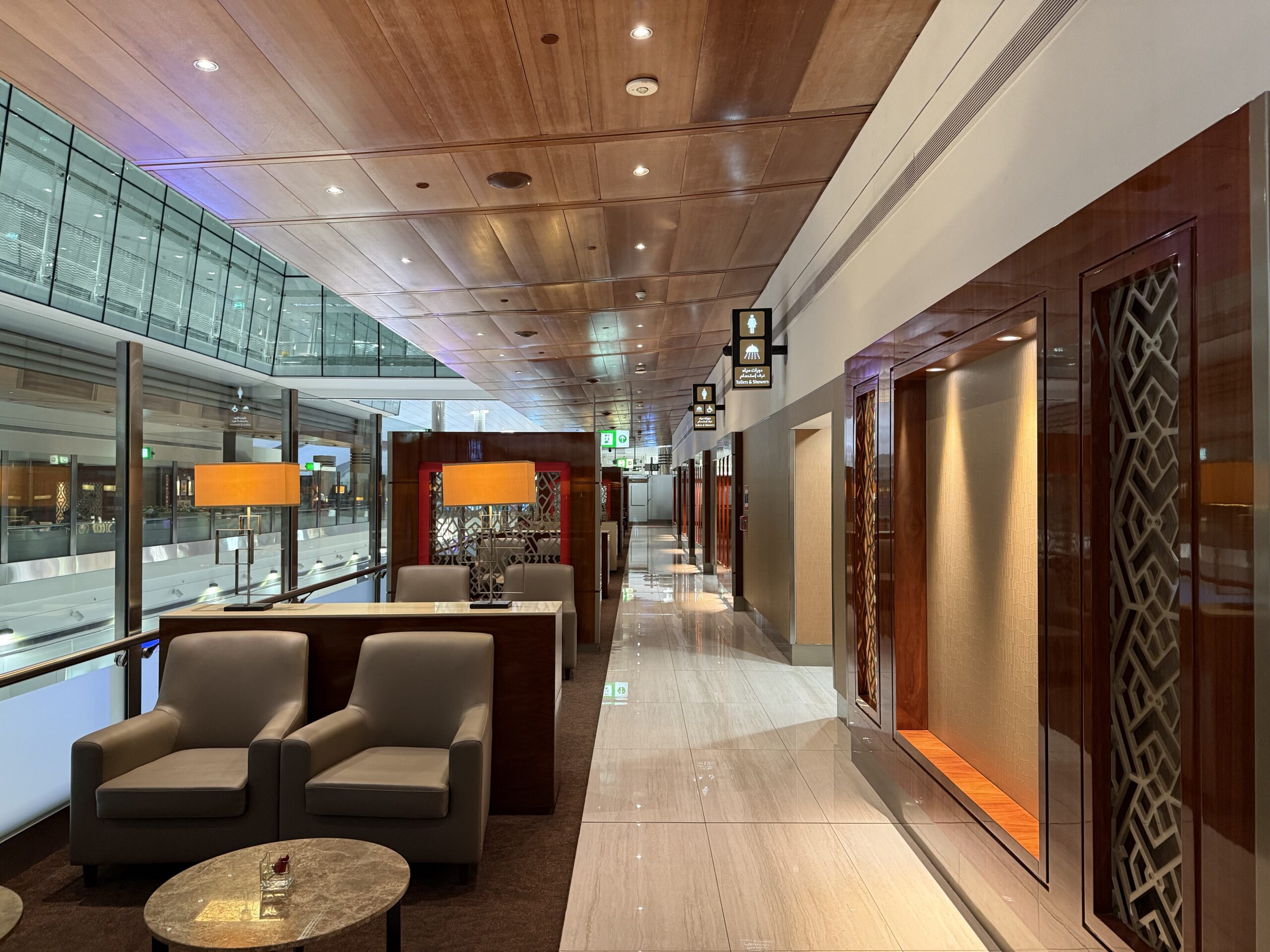 a long hallway with chairs and tables