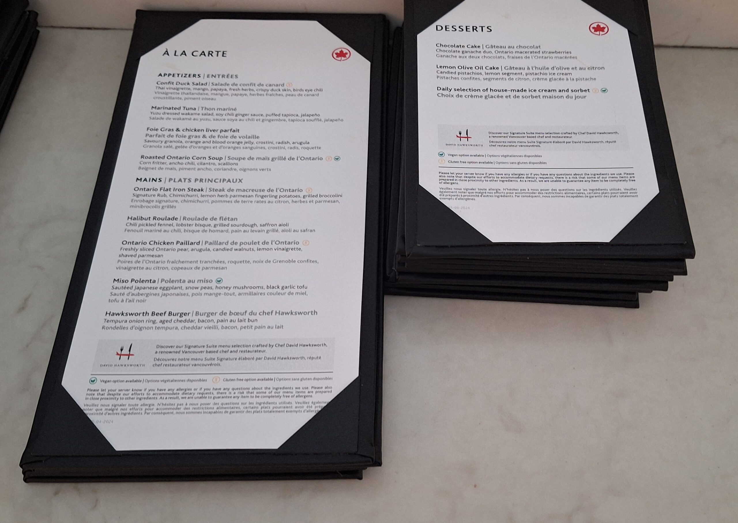 a stack of black menus