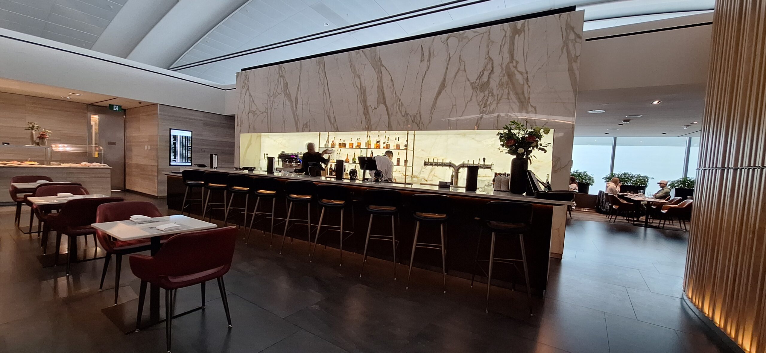 a bar with a counter and chairs