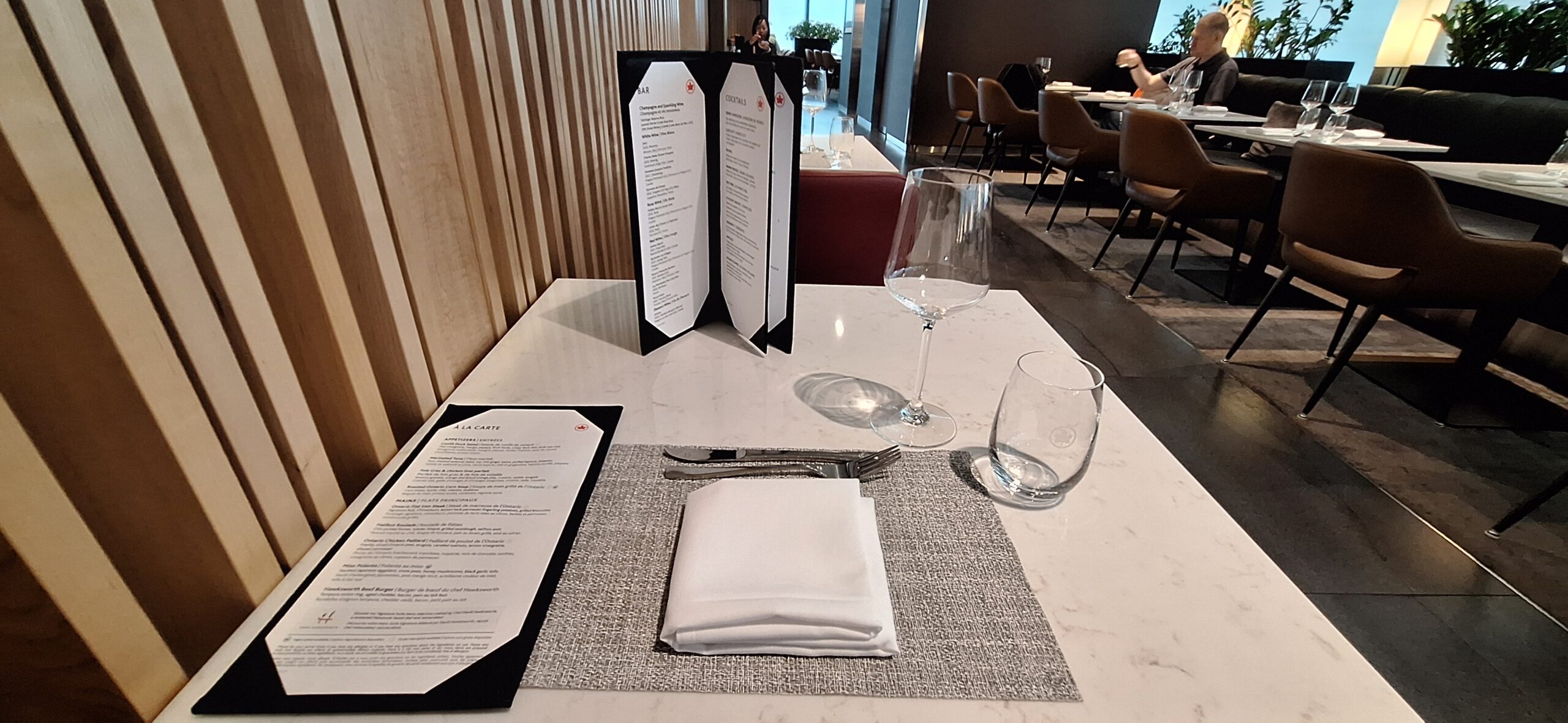 a table with menus and glasses