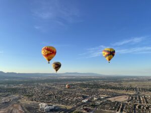 a group of hot air balloons in the sky