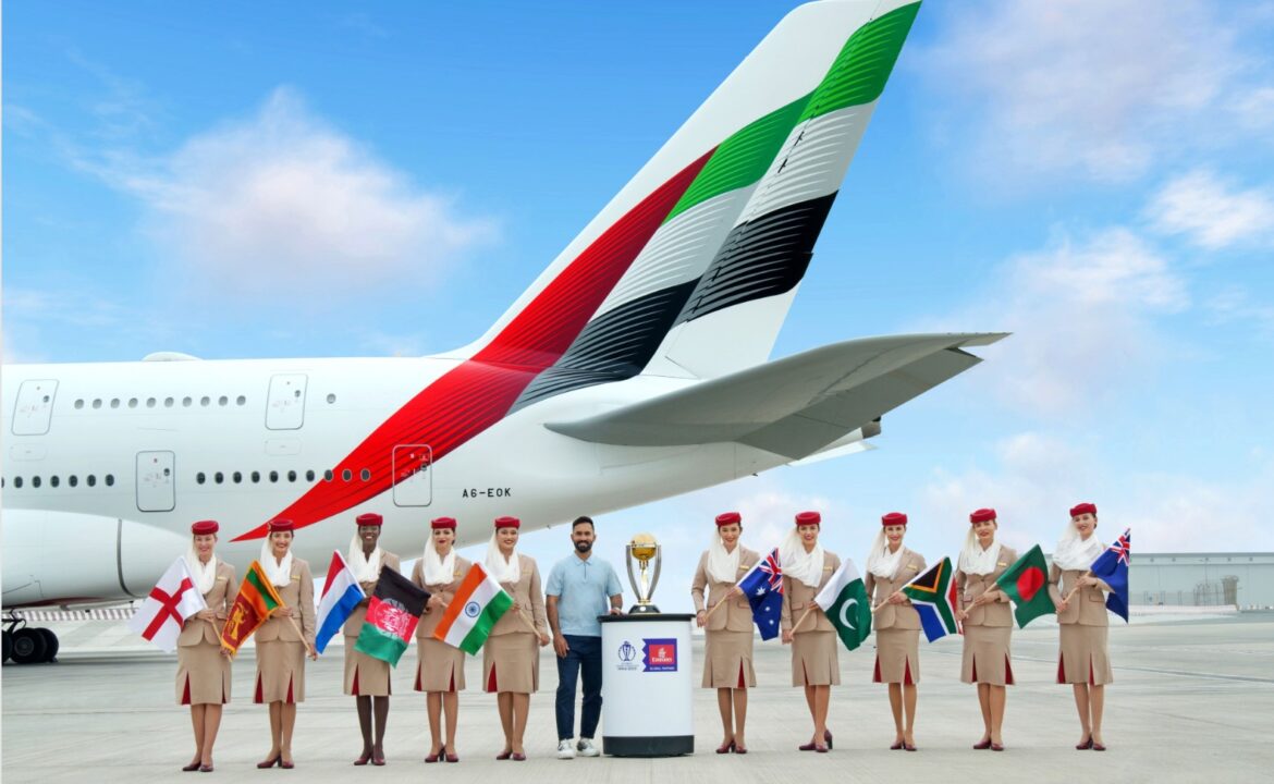 a group of people standing in front of a plane
