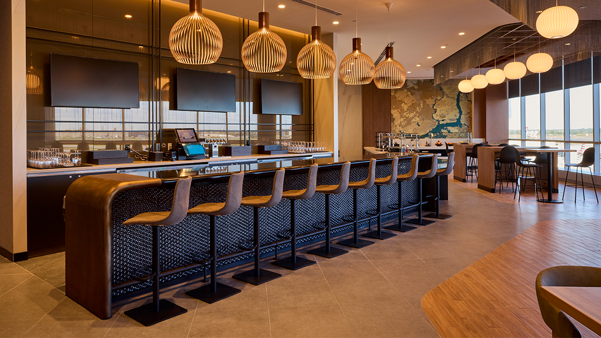 American Flagship Lounge PHL a bar with chairs and a counter