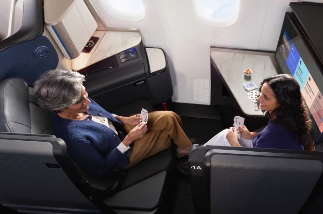 United Polaris Studio a woman sitting in a chair playing cards