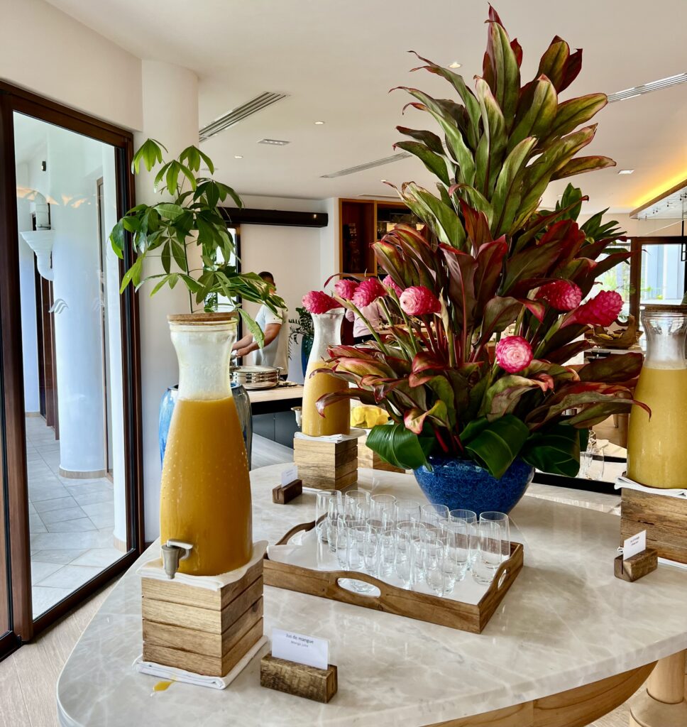 a table with glasses and a plant on it
