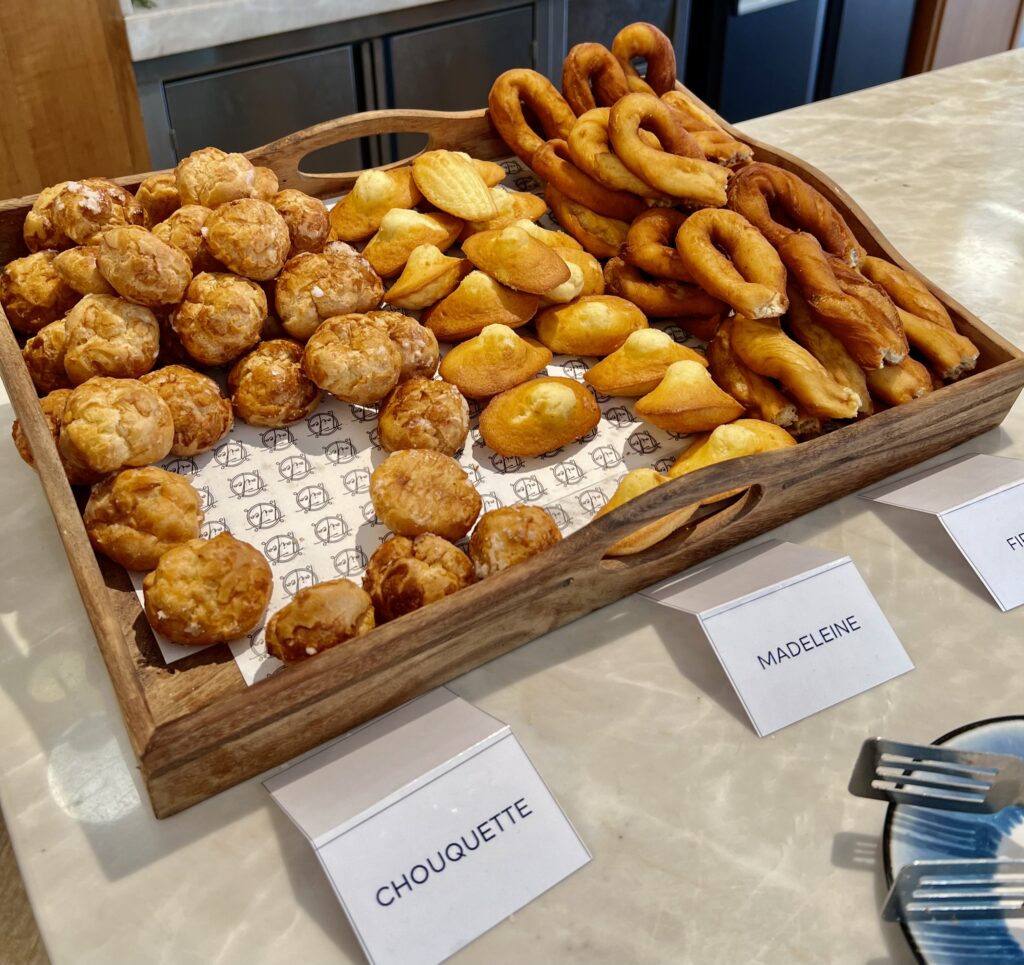 a tray of pastries and pretzels