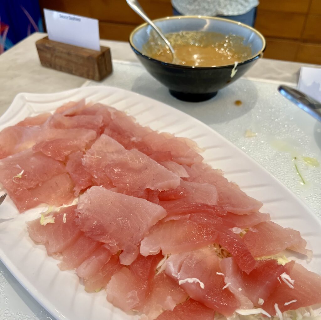 a plate of raw meat on a table