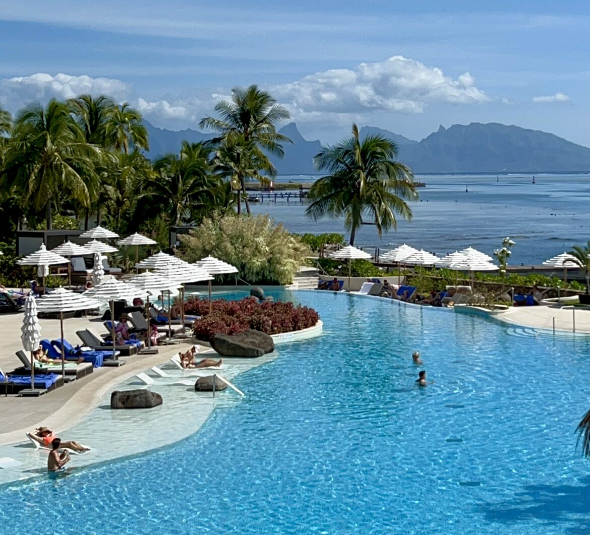 a pool with people swimming in it