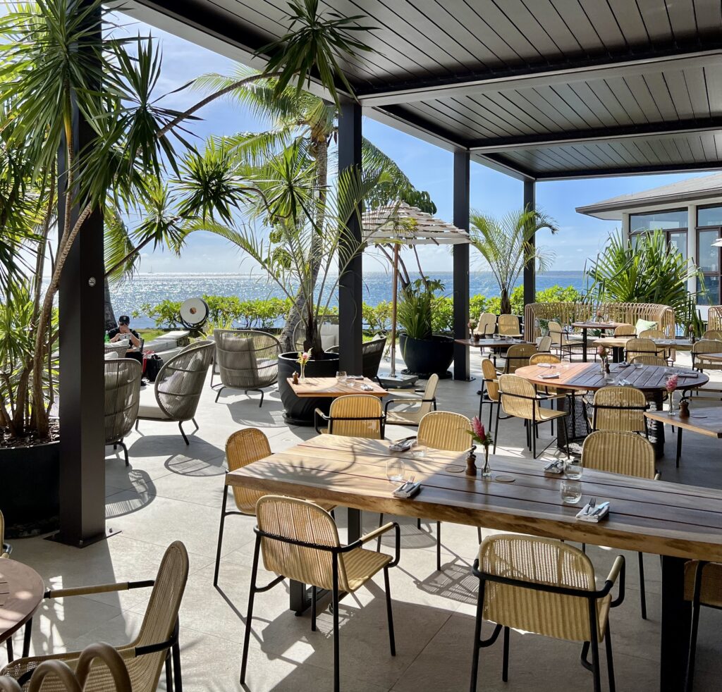 a restaurant with tables and chairs on a patio