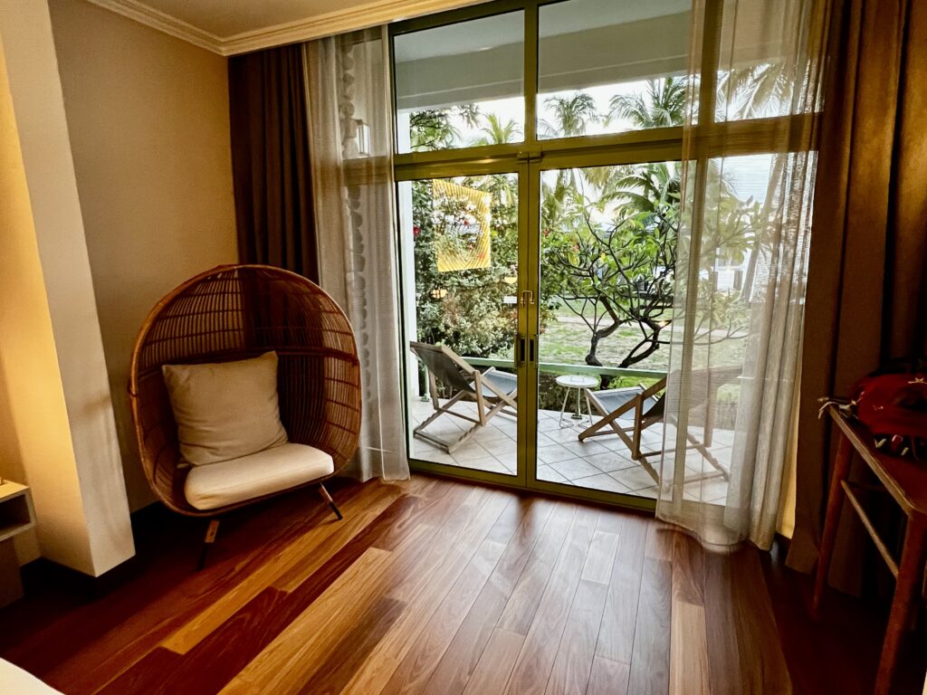 a room with a chair and a glass door