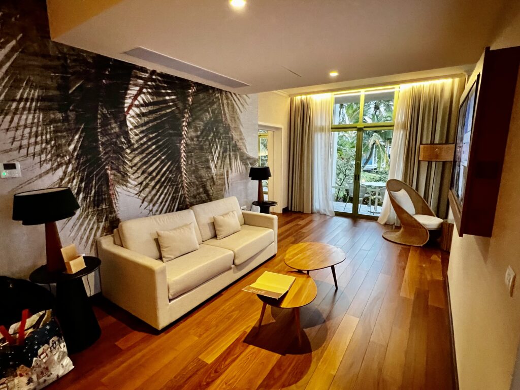a room with a couch and table and chairs