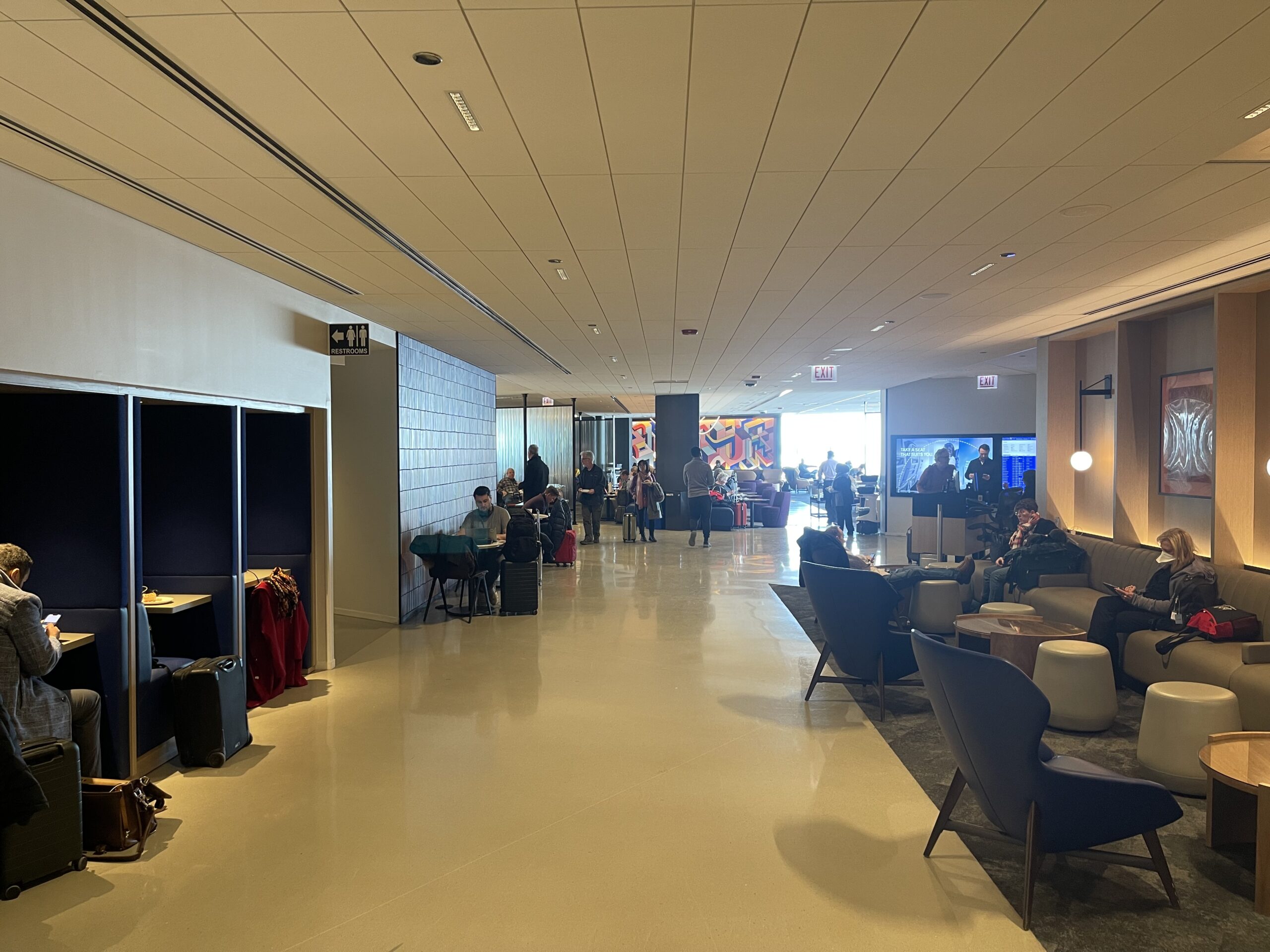 United Club Chicago ORD a group of people in a lobby