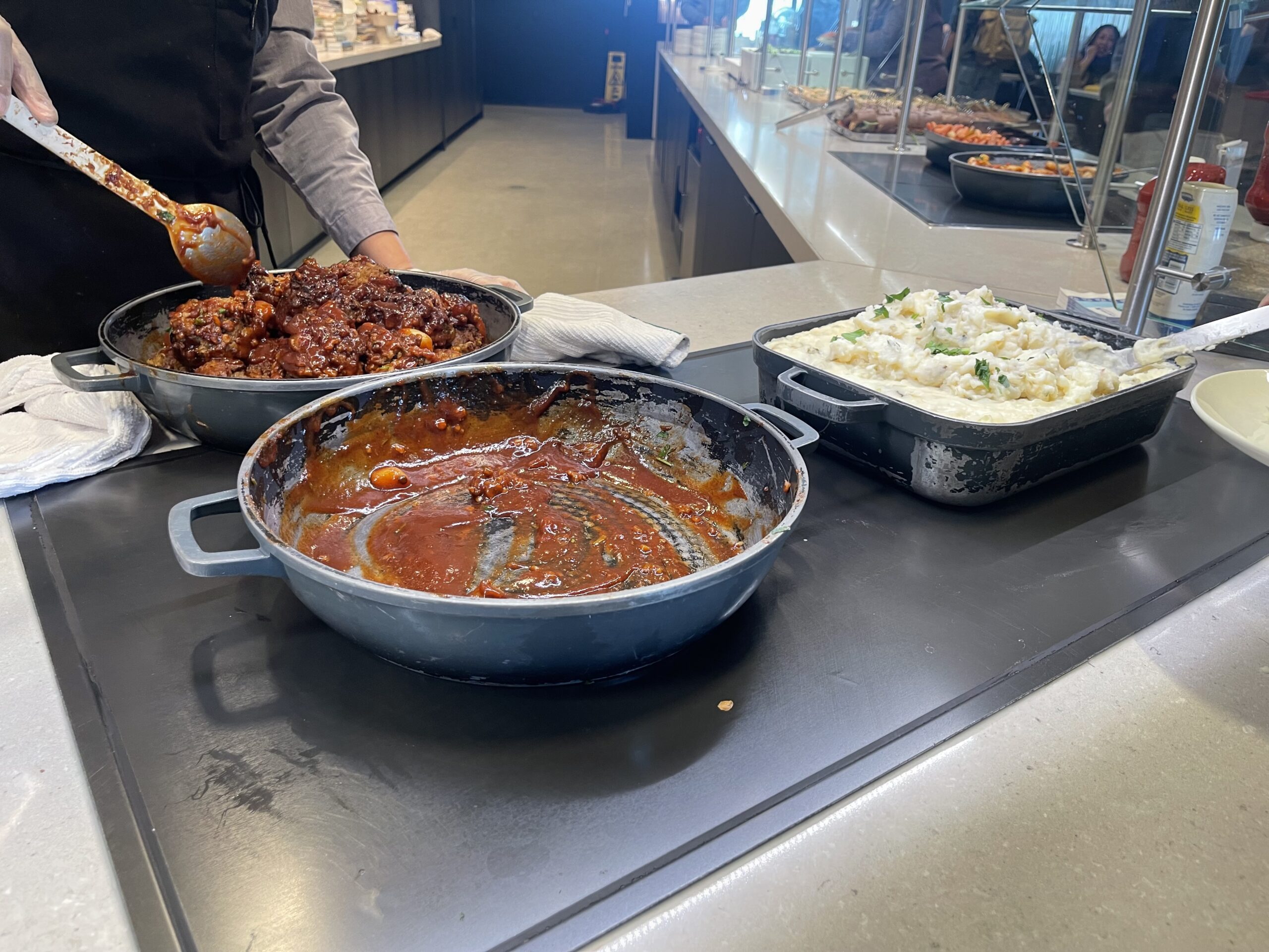 United Club Chicago ORD a group of pans with food in them