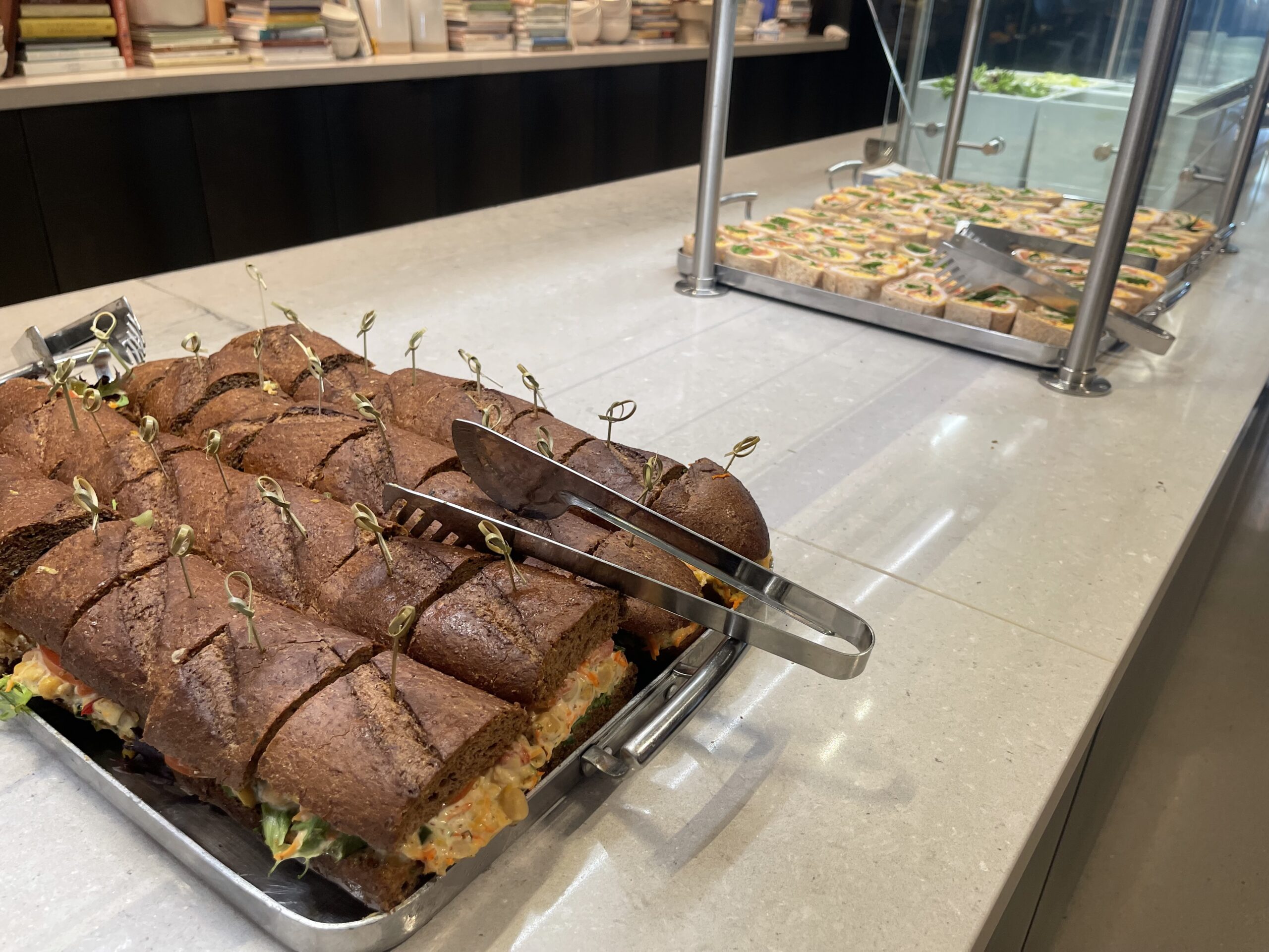 United Club Chicago ORD a sandwich with sprouts on top of it