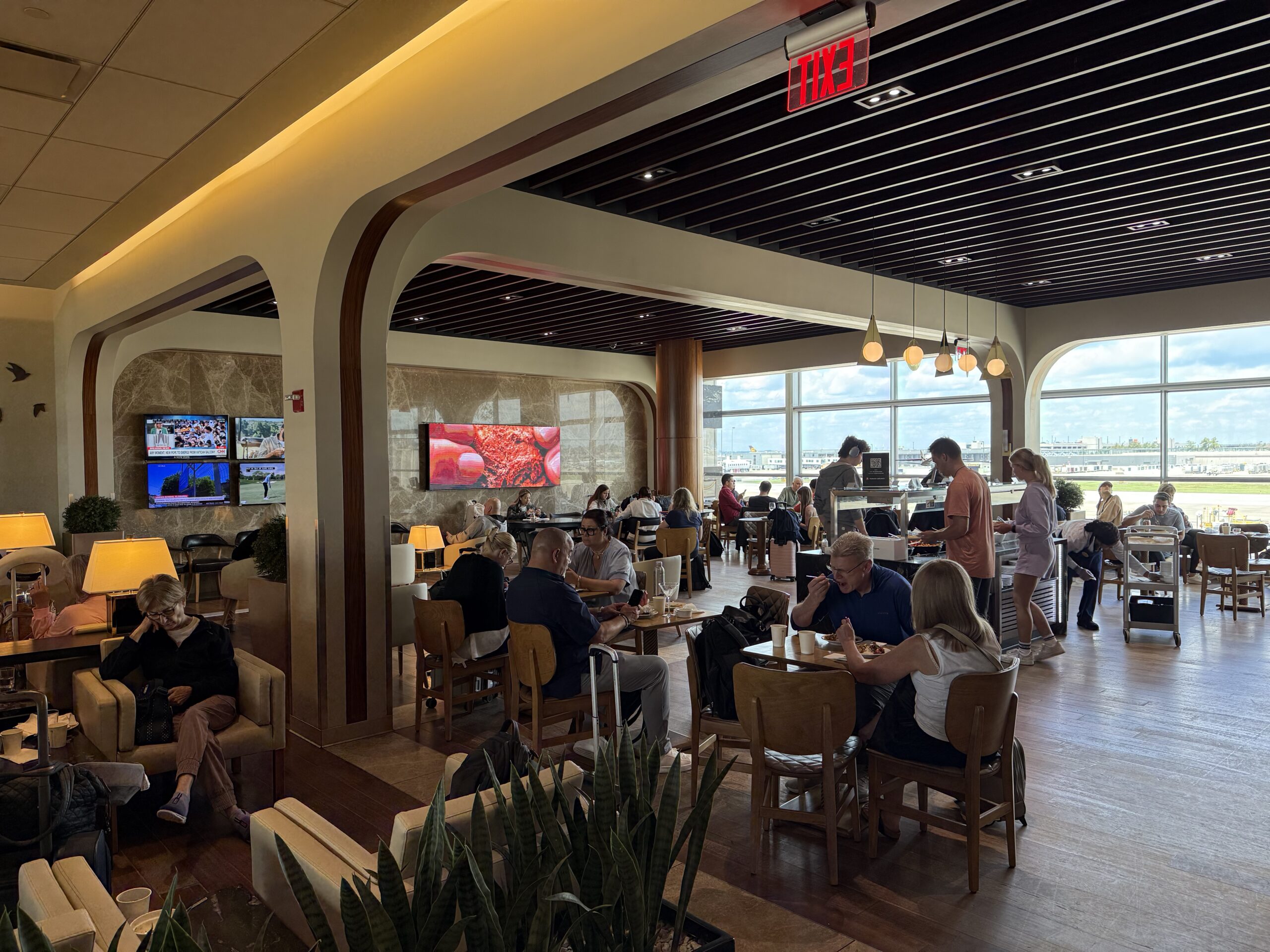 Turkish Airlines Lounge Washington a group of people sitting at tables in a restaurant