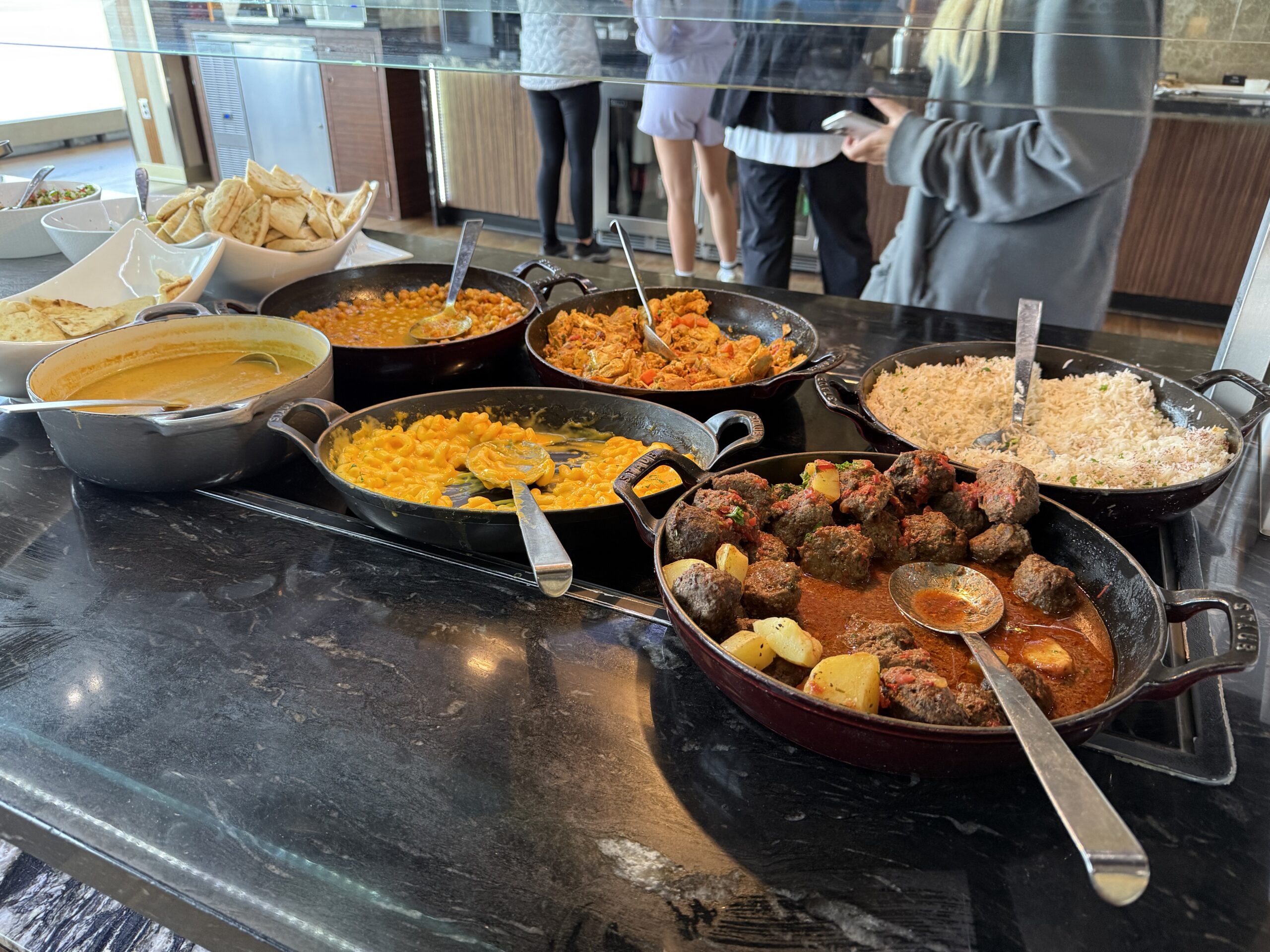 Turkish Airlines Lounge Washington a group of bowls of food on a counter