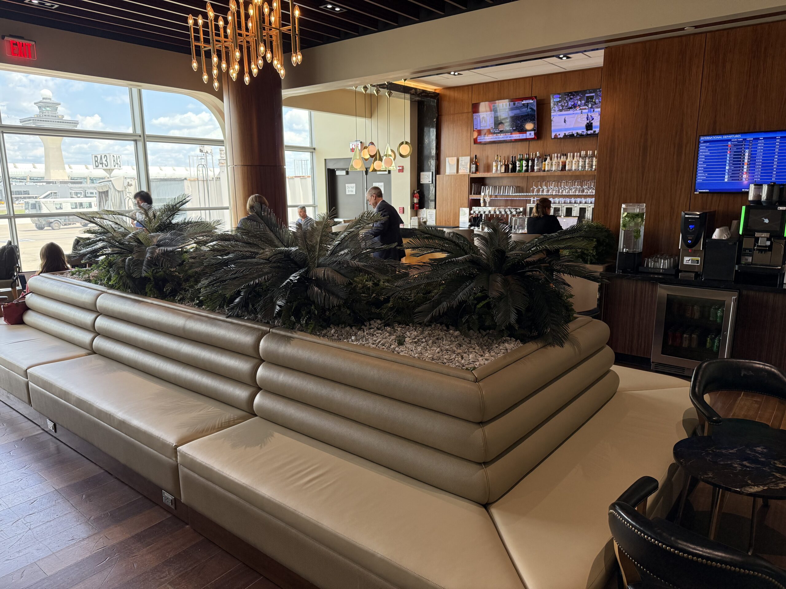 Turkish Airlines Lounge Washington a large white couch with plants on it