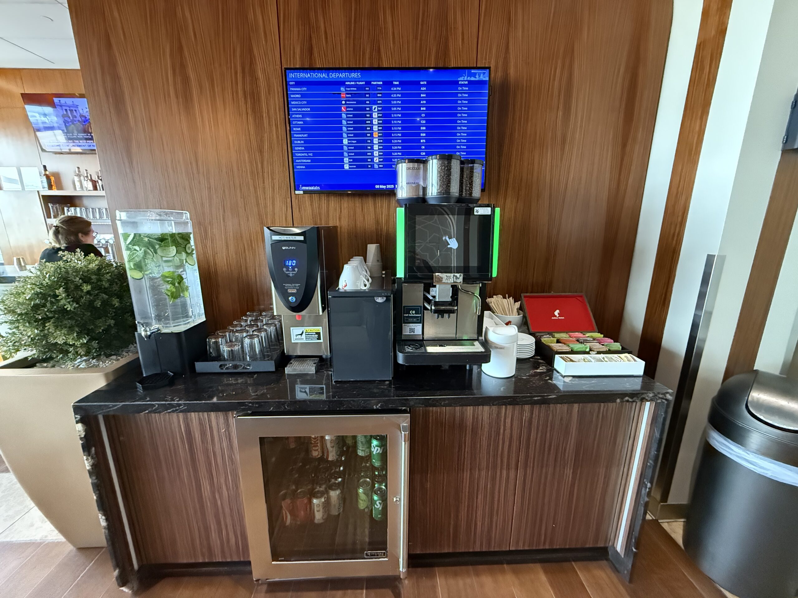 Turkish Airlines Lounge Washington a coffee machine and a monitor on a counter