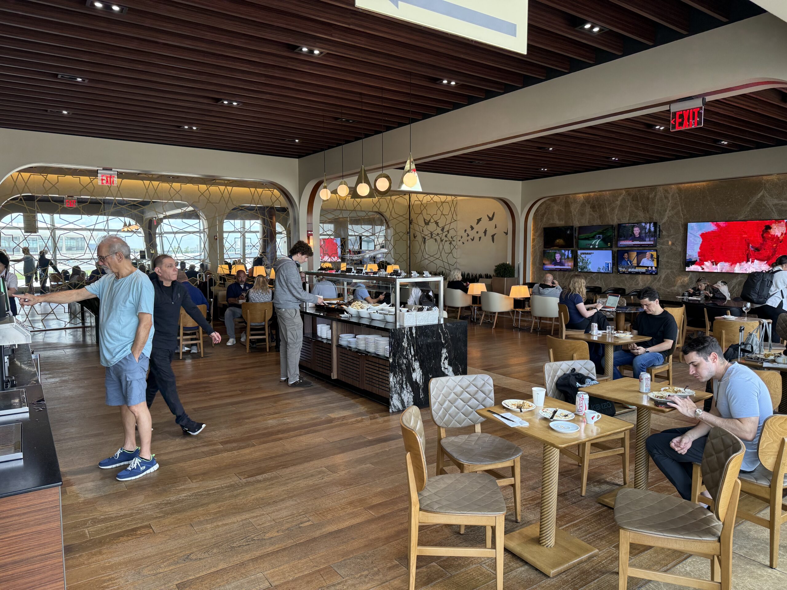 Turkish Airlines Lounge Washington a group of people sitting at tables in a restaurant