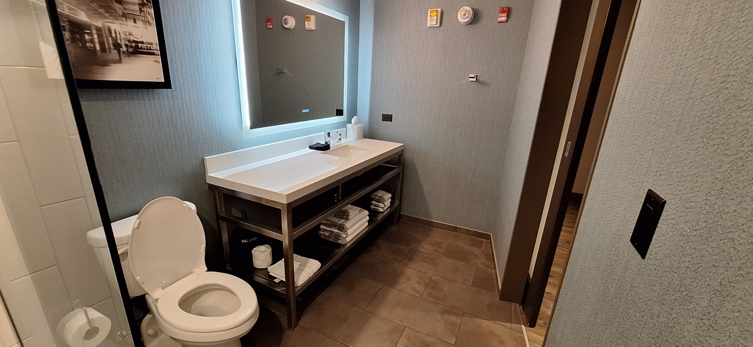Cambria Hotel Chicago a bathroom with a mirror and a sink