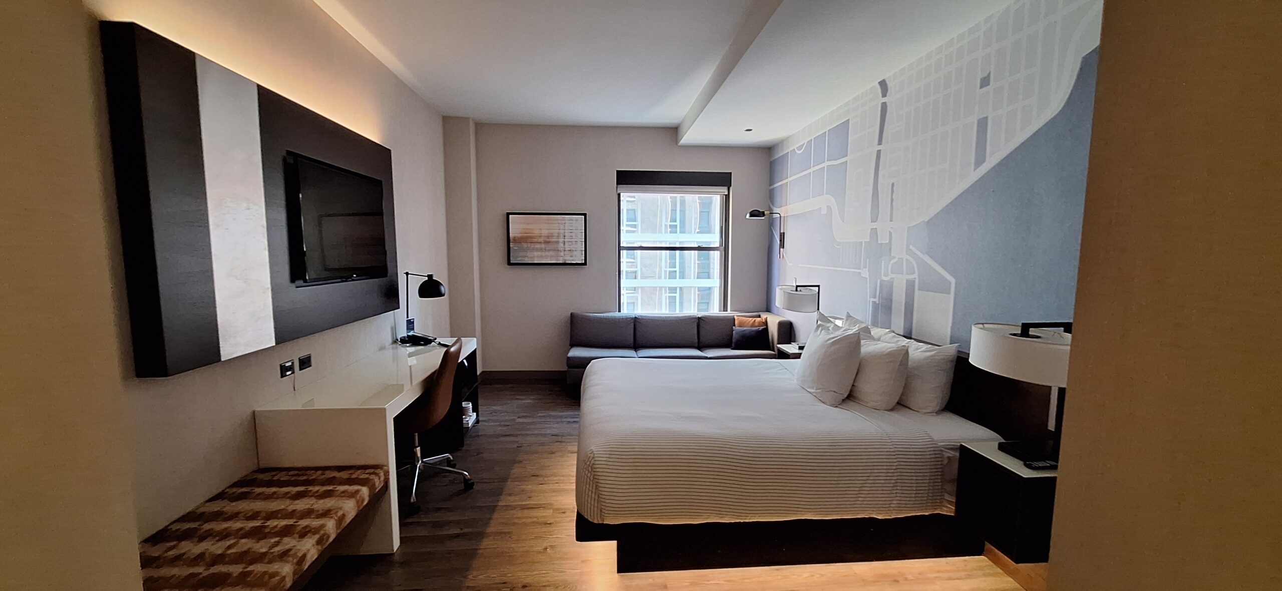 Cambria Hotel Chicago a room with a bed and a couch