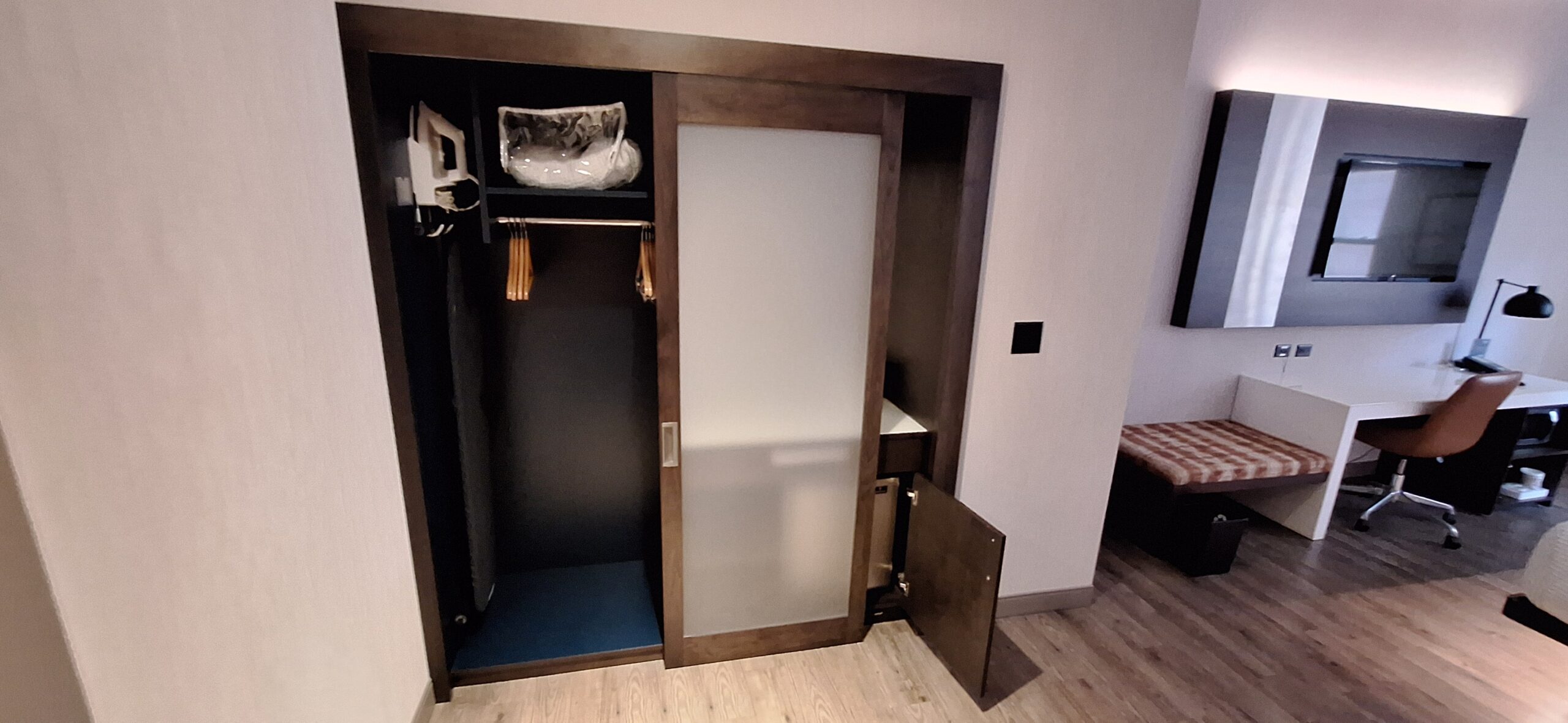 Cambria Hotel Chicago a closet with a door open