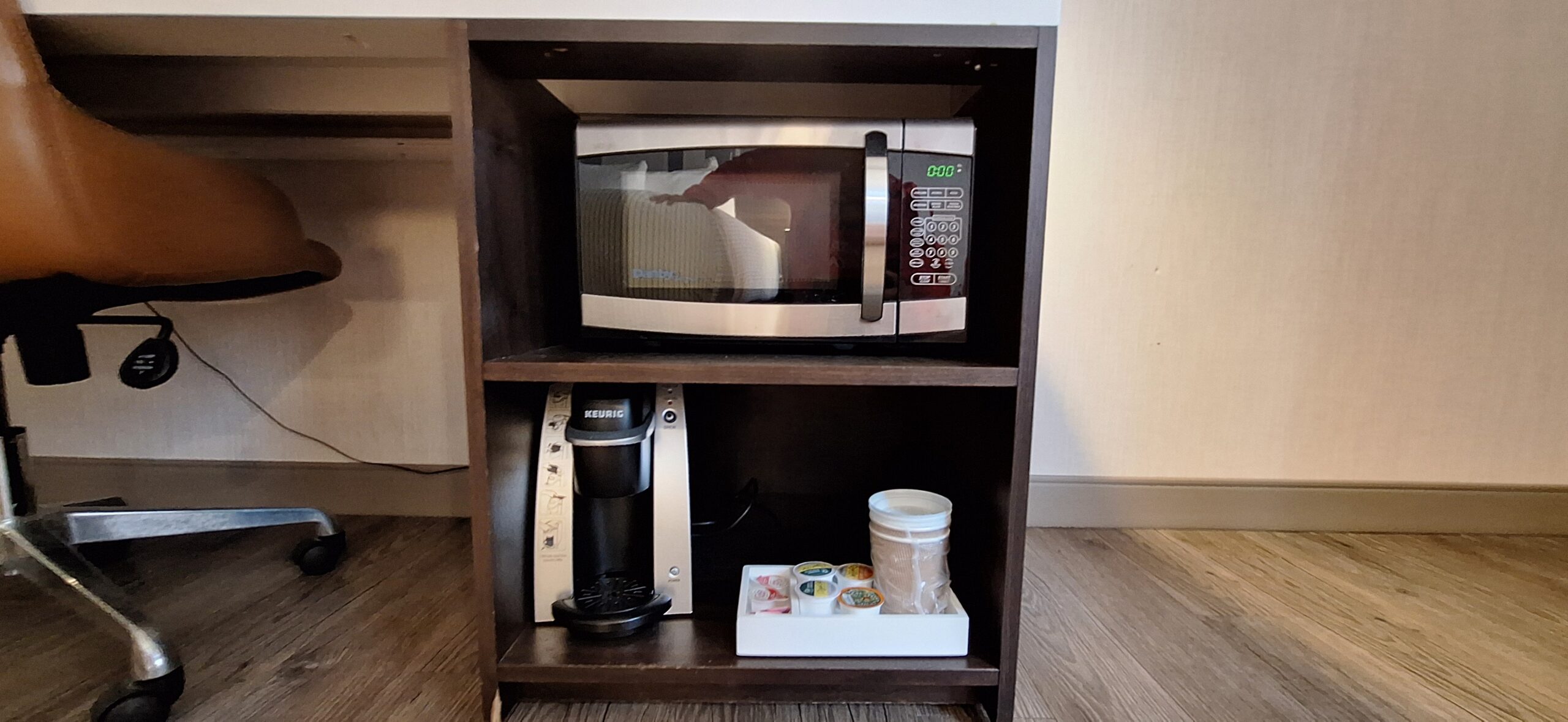 Cambria Hotel Chicago a microwave and coffee maker on a shelf