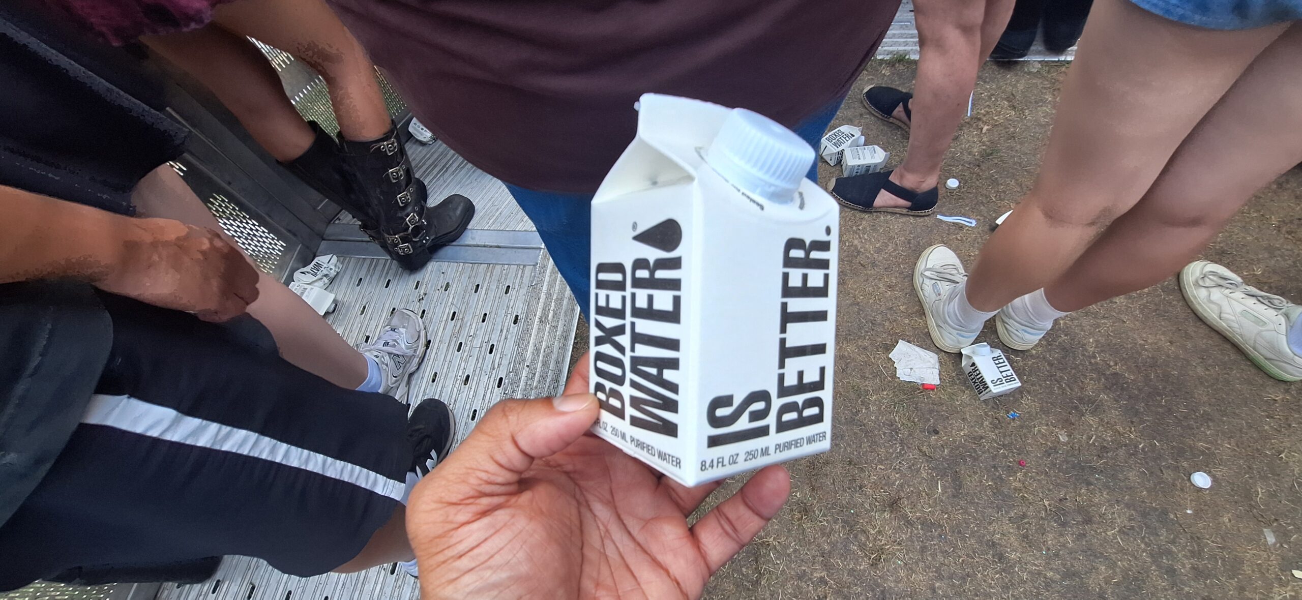 Lollapalooza Festival a hand holding a carton of water