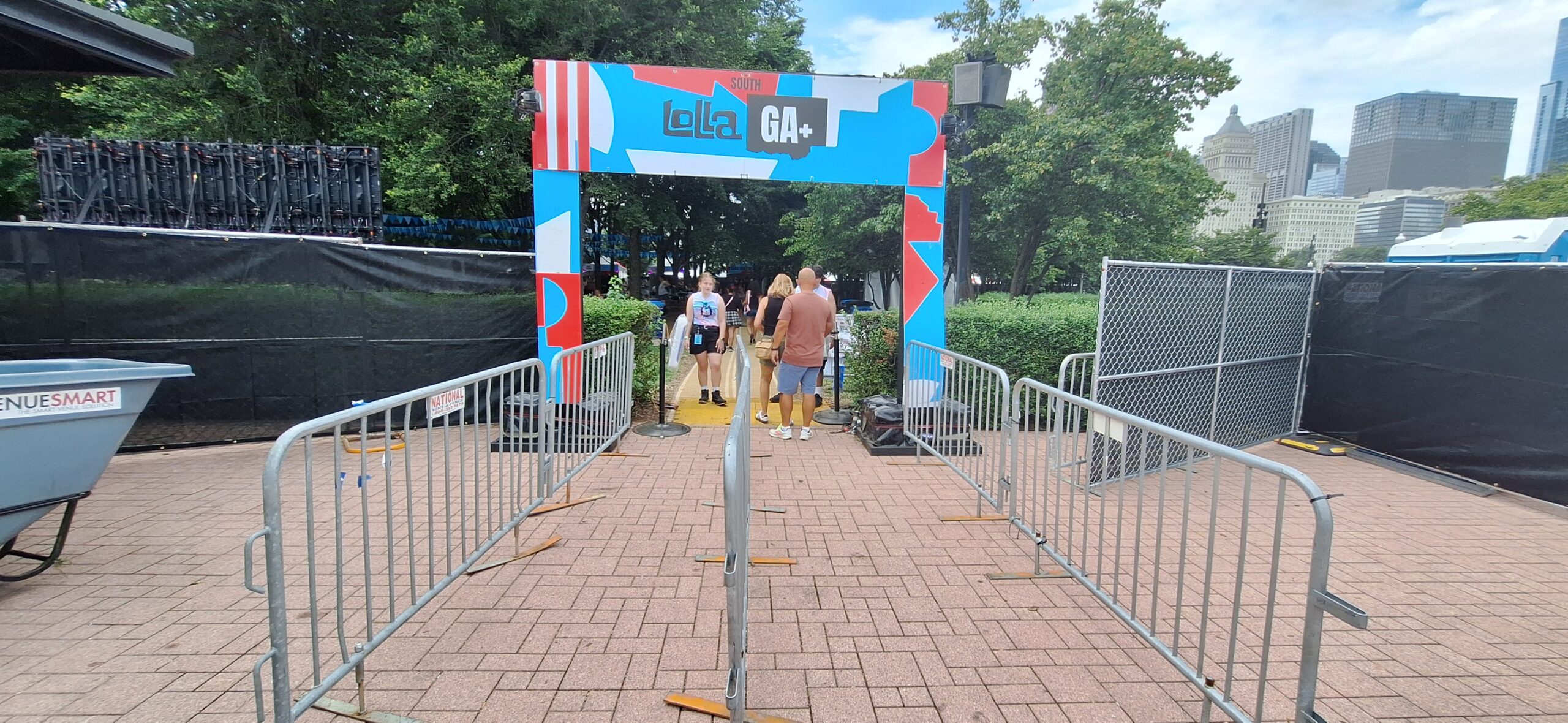 Lollapalooza Festival a group of people standing in front of a gate