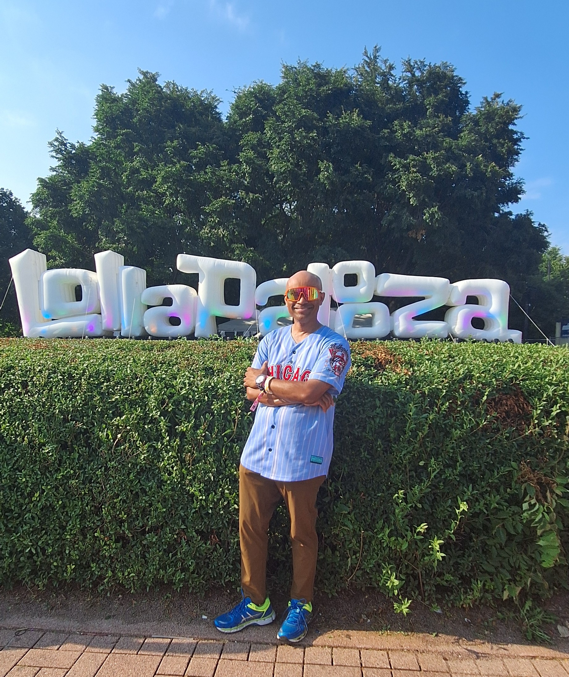 a man standing in front of a sign