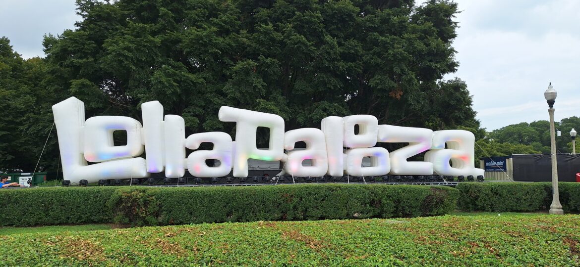 a large white letters on a green hedge