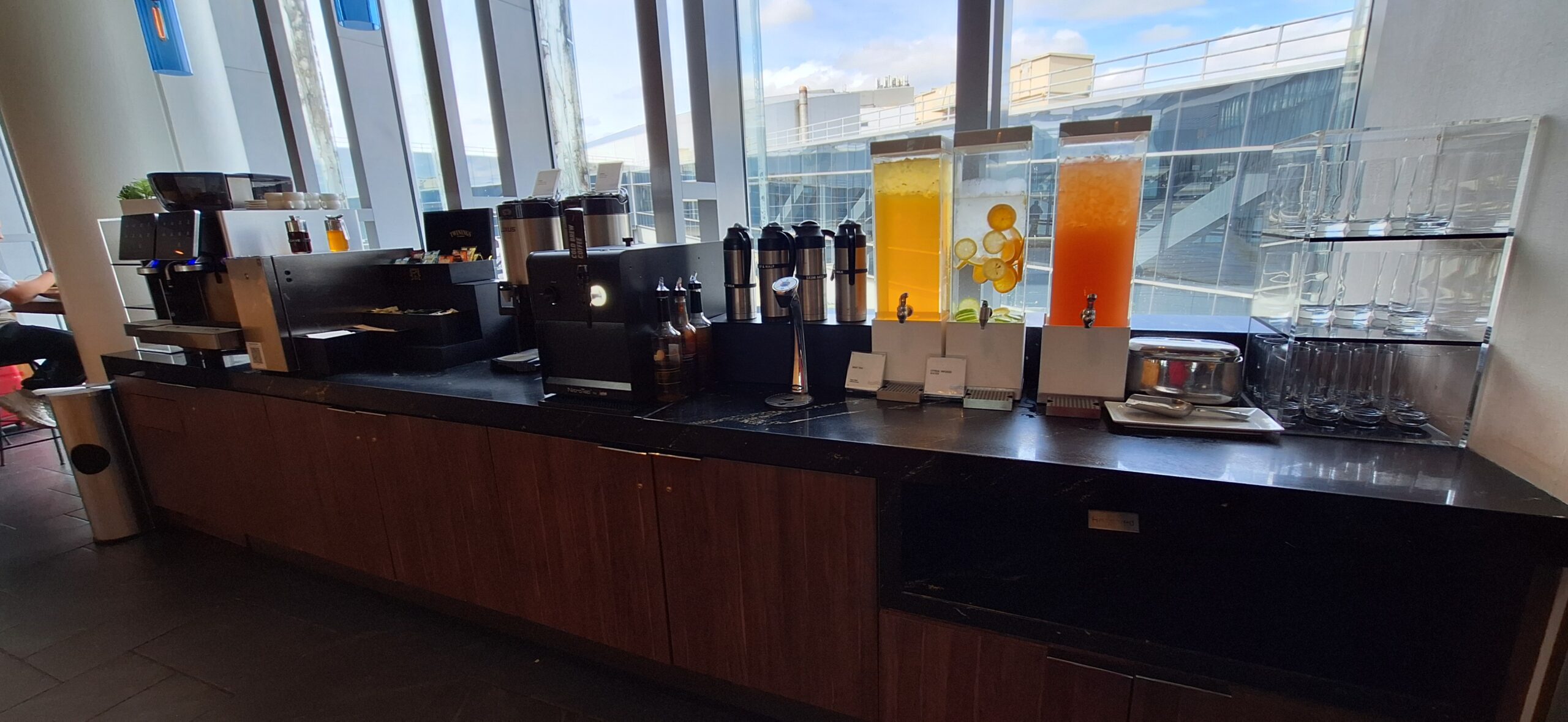 Centurion Lounge Philadelphia a counter with different drinks on it