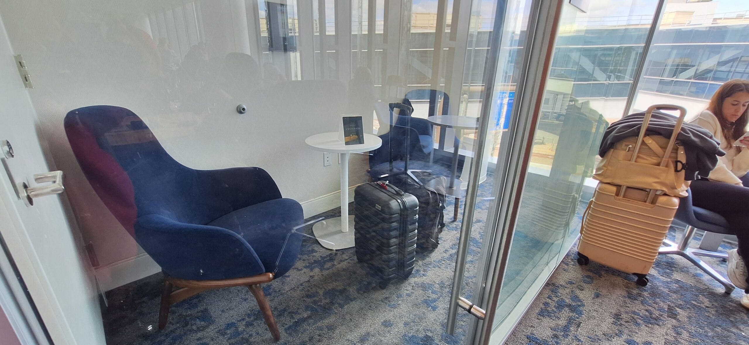 Centurion Lounge Philadelphia a room with chairs and a table and chairs