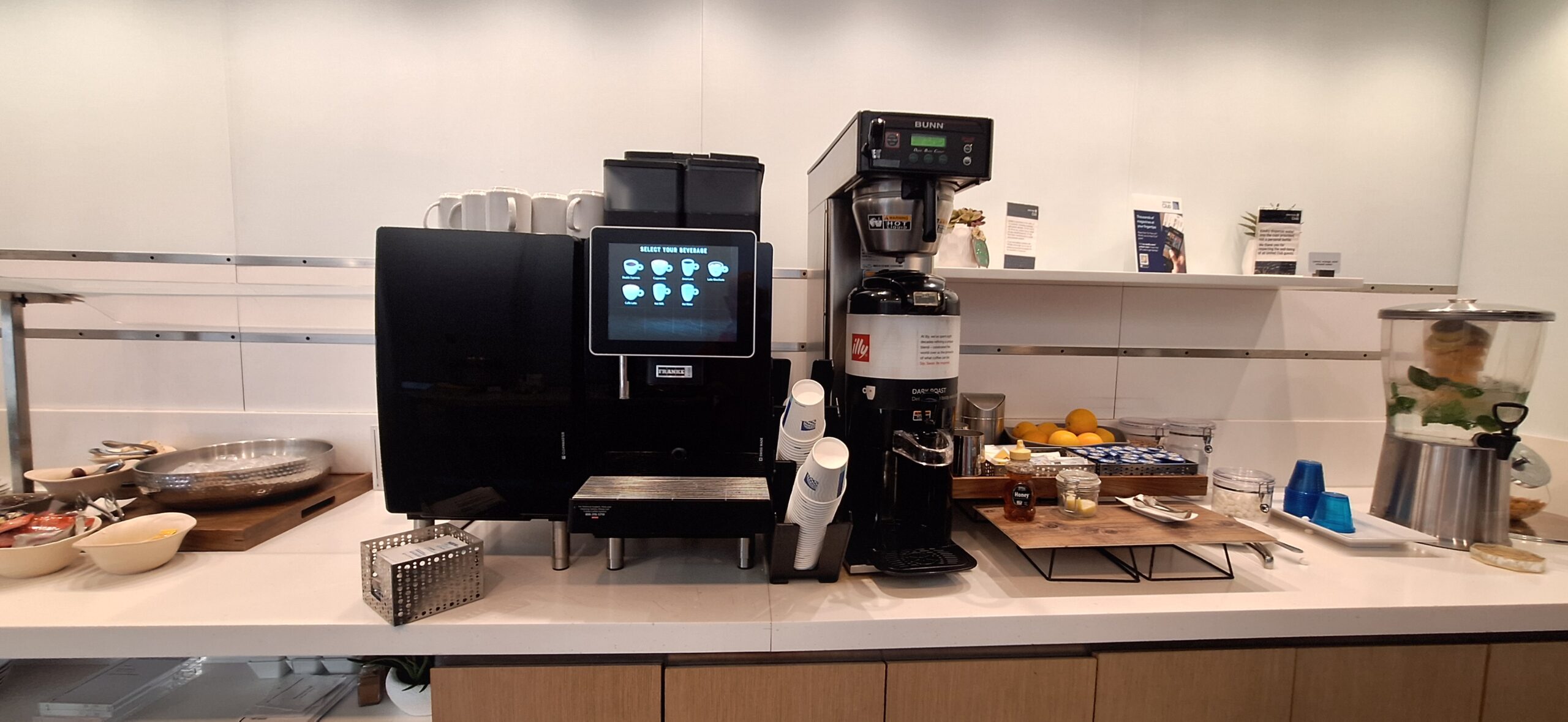 a coffee machine and coffee cups on a counter