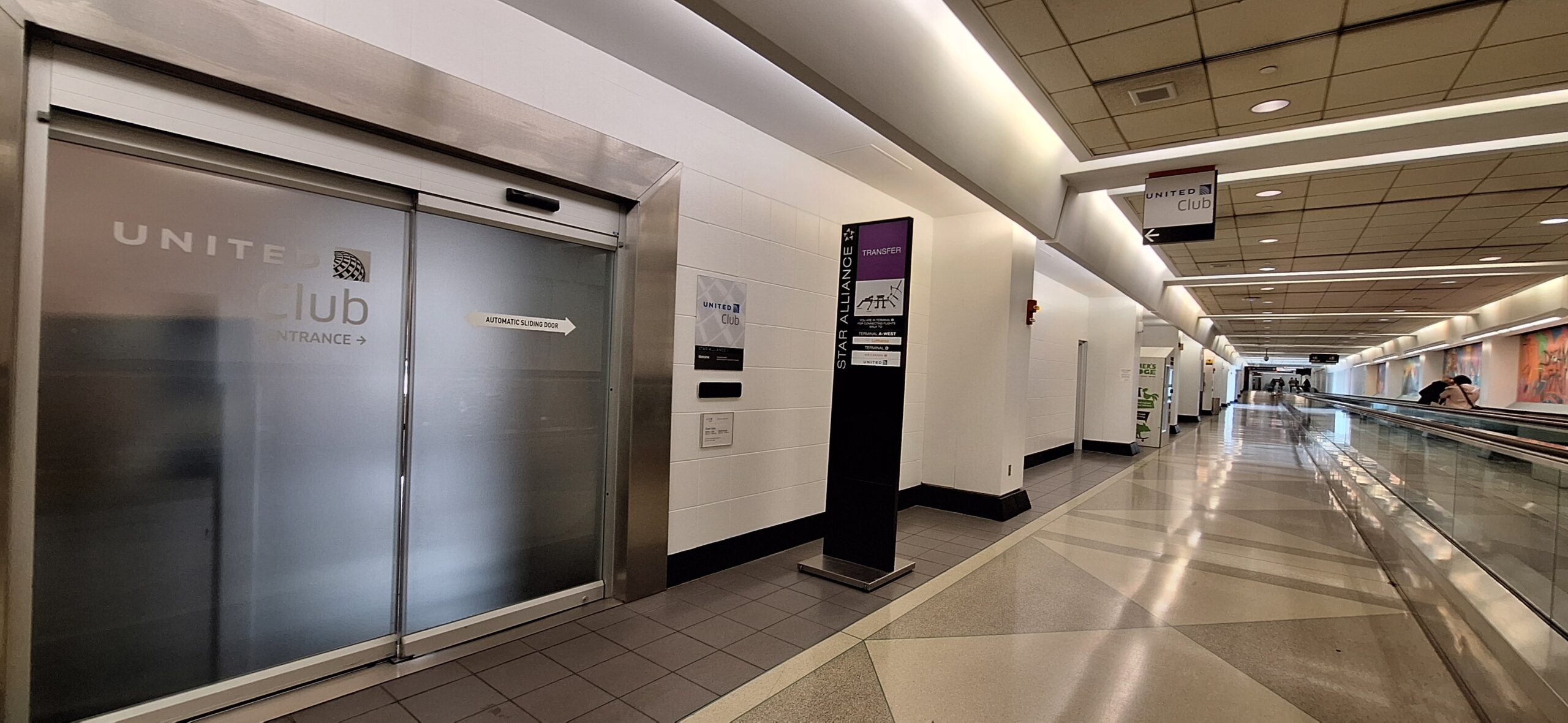 an elevator with a sign and a door
