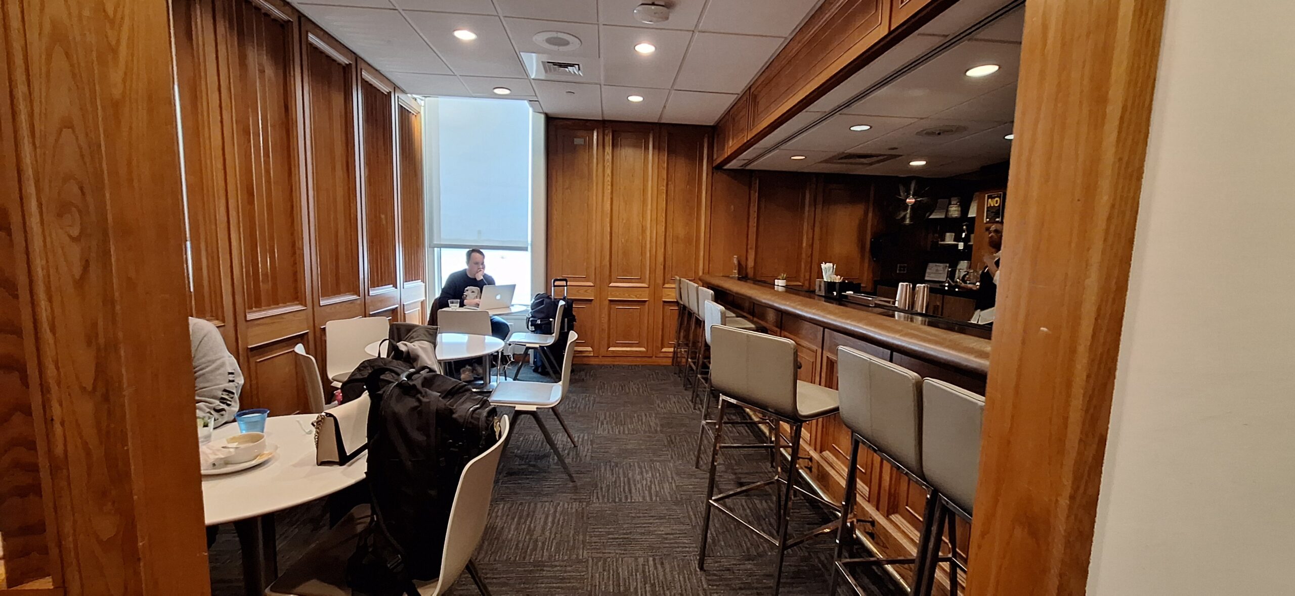 a man sitting at a table with a laptop