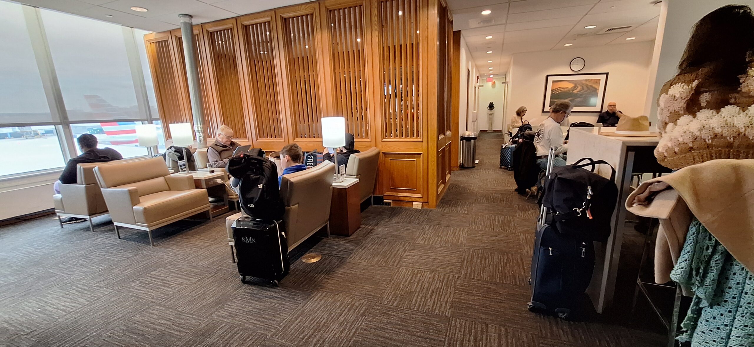 a group of people sitting in a hotel lobby