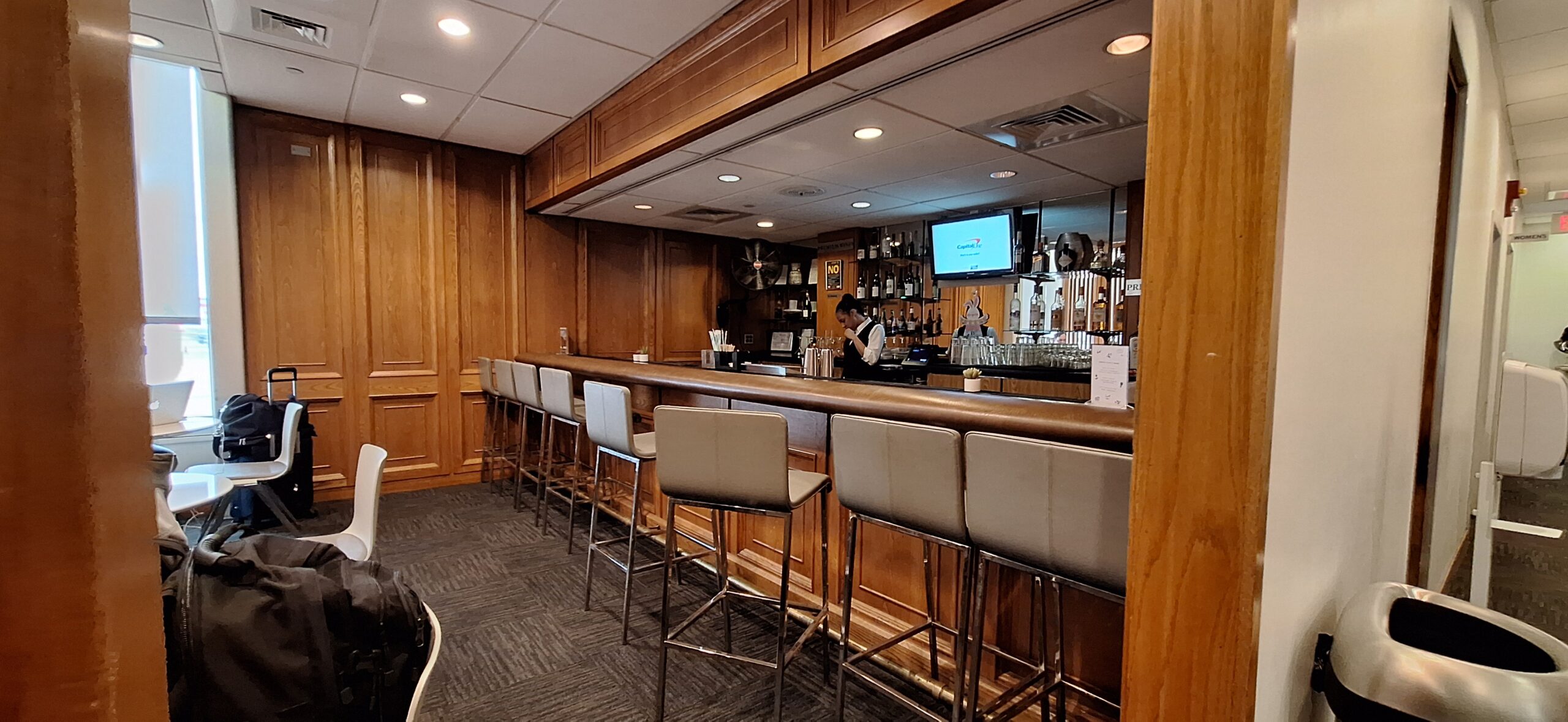 a bar with a man behind it