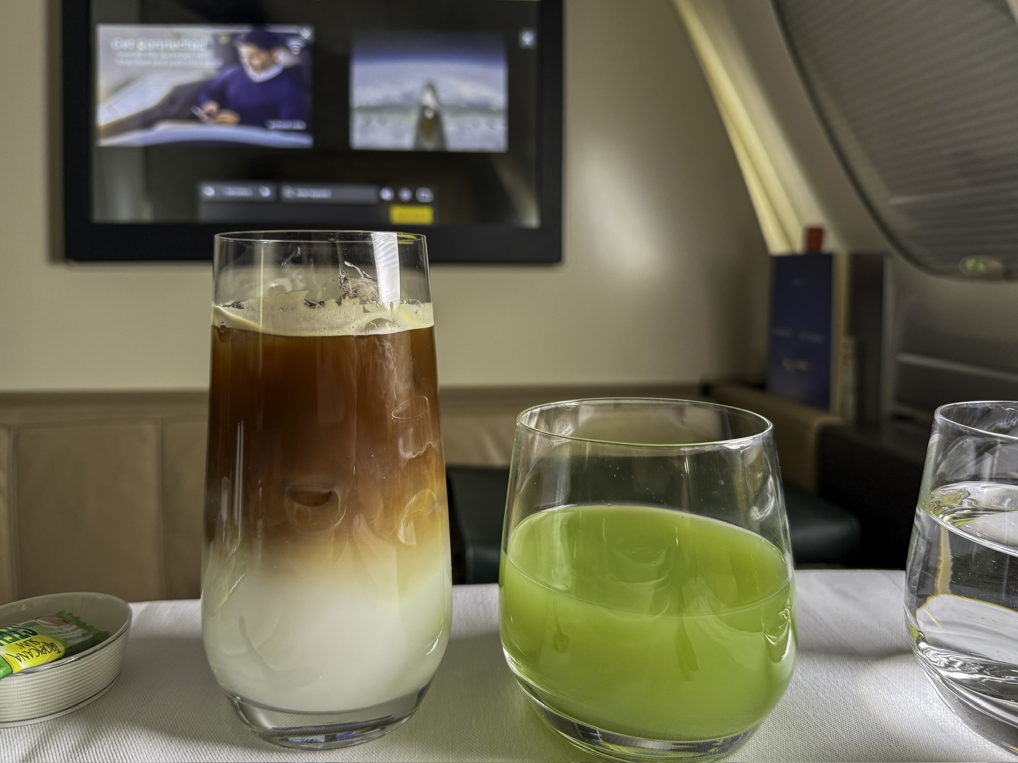 a glass of liquid next to a glass of liquid