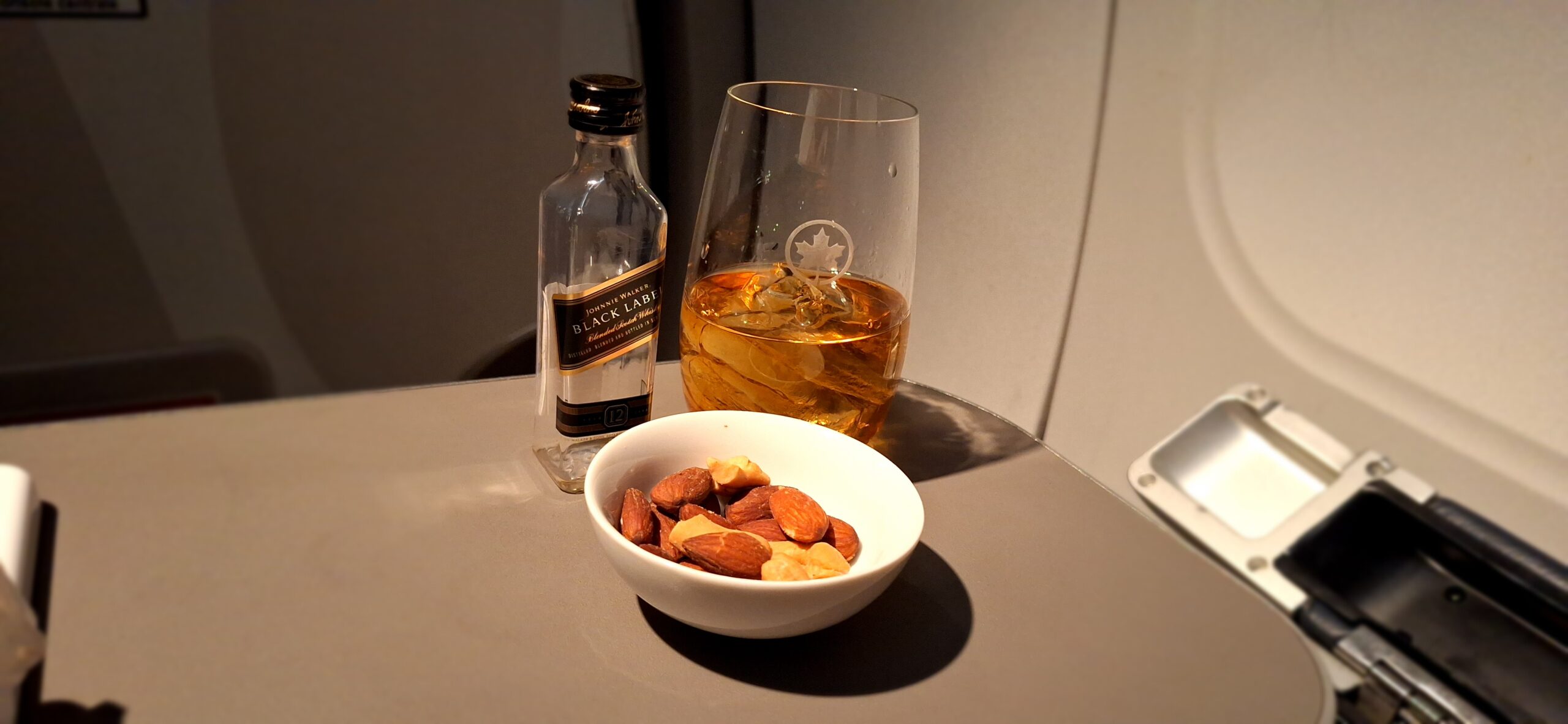 Premium Rouge a bowl of nuts and a bottle of liquor